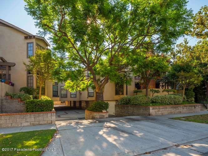 Situated in the desirable neighborhood of Madison Heights Pasadena, this newly remodeled townhome is just minutes away from Old Town Pasadena, Paseo Colorado, Trader Joe's, Whole Foods Market, Metrolink services, Downtown Los Angeles & freeways. The inviting interior includes a step-down living room with high ceilings, wood flooring & a wood-burning fireplace with gas starter. A second portion of the living room can be configured into a lovely sitting area or office that opens to a serene patio. The exquisitely renovated kitchen includes Quartz counters, Shaker style cabinets, recessed lighting & tons of storage. Unlike many other units, the dining area has an abundance of natural lights & includes an intimate breakfast bar perfect for entertainment. The 1st floor also includes a remodeled powder room. The 2nd floor features multiple skylights, all new flooring, linen closet as well as the laundry facility. The light filled master bedroom has a renovated ensuite bathroom & generous closets. The other suite offers a 2nd full bath. Additional upgrades include complete re-pipping with PEX plumbing (2015), new paint (2025), newer AC/heater (2017) & a 2-car direct access garage with plenty of cabinet storage. This is a ready to move-in home!