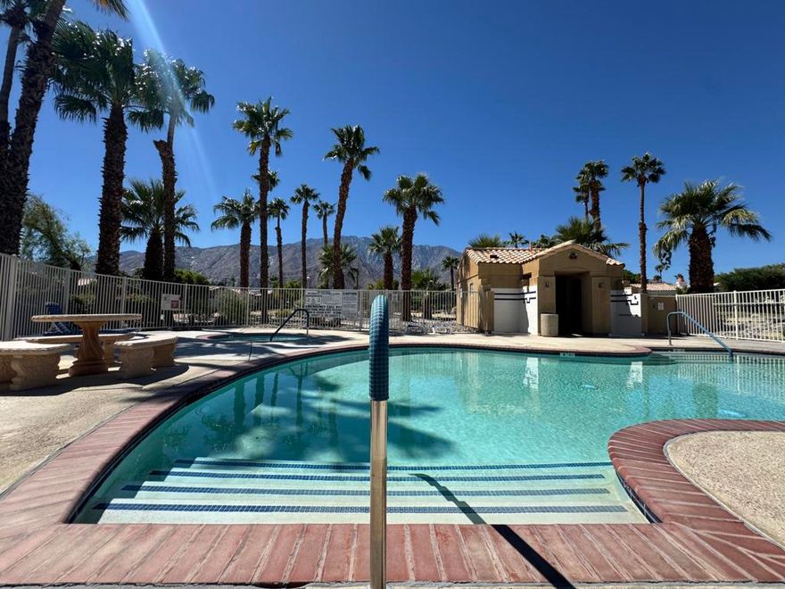 This Palm Springs residence offers comfort and style across 1,588 sq. ft. The single-story layout encompasses three bedrooms and two bathrooms. Imagine walking into your new home through the tranquil courtyard, complete with a water fountain and palm trees, to get the sensation of your personal oasis. The heart of the home is an open-concept living area, featuring a cozy fireplace and sliding glass doors that seamlessly connect to the south-facing backyard. The kitchen is well-equipped with wooden cabinetry, granite countertops, and appliances. Throughout the home's common areas, large windows and custom window coverings allow for natural light to brighten your home. The main bedroom features a walk-in closet with custom-built shelves for ample closet space. Additional features include tile flooring in common areas and a dedicated laundry space. There are low HOA dues, and you own the land. The HOA includes front yard landscaping maintenance. The community offers a refreshing pool with mountain views and a spa. The property's location offers a delightful Palm Springs living experience, complete with palm tree views from select windows, proximity to the I-10 freeway, Palm Springs Aerial Tramway, and the famous Downtown Palm Springs, including shops, restaurants, and museums. Come be a part of where the magic happens.