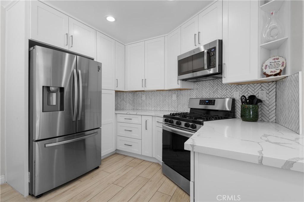 **Welcome to this beautifully inviting three-bedroom, two-and-a-half-bathroom residence, where comfort and convenience blend seamlessly in the highly sought-after gated community of Canyon Park, ideally located adjacent to Fair Oaks.**
From the moment you step inside, you’ll be greeted by a freshly upgraded, sun-filled interior that radiates pride of ownership. The open-concept floor plan flows effortlessly, beginning with a spacious living room and dining area—perfect for gatherings large or small. The heart of the home is the stunning chef’s kitchen, showcasing gleaming quartz countertops, an eye-catching designer backsplash, an abundance of cabinetry, and sleek, newer stainless steel appliances. For added ease, the main level also provides direct access to the two-car garage and a conveniently placed powder room.
Throughout the home, wood-looking flooring creates a warm and timeless appeal. Upstairs, a versatile loft awaits—ideal as a home office, cozy reading nook, or dedicated study area. Two generously sized secondary bedrooms share the well-appointed hallway bath, while the luxurious primary suite steals the show with soaring ceilings and an elegant spa-like bathroom. This retreat features a designer-tiled stand-up shower, updated lighting, stylish vanity mirrors, and a spacious walk-in closet to complete the space.
Additional upgrades include a newer air-conditioning unit and fresh interior and exterior paint, ensuring peace of mind and modern comfort. Step outside to the backyard sanctuary—an inviting space to relax, entertain, or simply bask in the year-round California sunshine. Residents of Canyon Park enjoy a beautifully maintained neighborhood with effortless access to premier shopping, dining, and award-winning schools. Best of all, this home comes with **no Mello Roos and a low HOA**—making it the perfect blend of charm, convenience, and value.