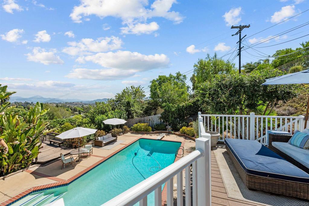 Tranquil and private 5-bedroom, 4-bath retreat nestled in the serene Mount Helix community, offering breathtaking mountain and sunrise views. This thoughtfully updated home exudes warmth and comfort, with freshly painted interiors, new shutters, and elegant LVP flooring in the living room. The expansive main suite, complete with a full bath, provides a peaceful sanctuary to unwind and enjoy quiet moments. Step outside to the sparkling pool and new composite deck, perfect for relaxation, entertaining, or savoring the morning sun. Recent upgrades include a new roof, paid-off solar system, tankless water heater, updated plumbing with French drains, and new leaf filters on gutters. Combining modern efficiency with timeless charm, this private Mount Helix haven offers a harmonious blend of tranquility, comfort, and convenience, just minutes from shopping, dining, schools, and freeway access.