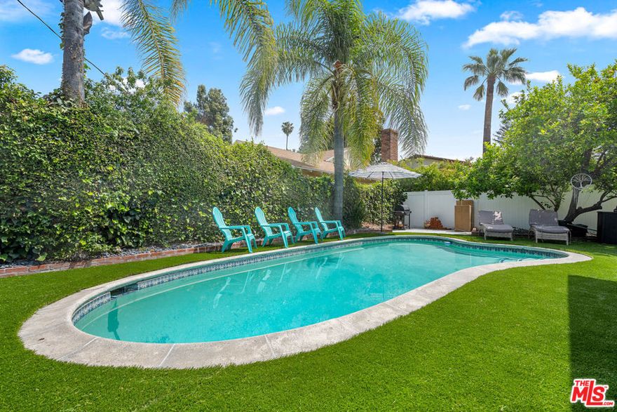 Nestled on a picturesque corner lot in the heart of Valley Village, this stunningly updated mid-century home has been transformed into a modern entertainer's paradise. A perfect blend of timeless charm and contemporary upgrades, this 4-bedroom, 2.5-bathroom residence is a true turnkey treasure.Step inside to discover a bright and inviting interior designed for today's lifestyle. The beautifully updated kitchen features sleek new counters, providing a stylish and functional space for culinary creativity. The home's heart is its welcoming family room, anchored by a cozy fireplace, which flows seamlessly into the main living areas. Highlighting the home's incredible versatility, the former garage has been brilliantly converted into a spacious recreation roomperfect for a home theater, gym, or ultimate game room.The upgrades continue in the newly renovated bathrooms, showcasing modern fixtures and finishes that create a spa-like atmosphere.The true showstopper is the spectacular backyard, designed for quintessential California hosting. Step outside to your private oasis featuring a sparkling pool and a brand-new outdoor BBQ area, making it the ideal setting for unforgettable summer parties and dining al fresco. This home was truly made for entertaining!Situated in a friendly and walkable neighborhood, you are just moments from local parks, popular cafes, and the excellent Burbank Boulevard Elementary School. With significant upgrades in all the right places, this is a rare opportunity to own a move-in-ready home built for making memories in one of the San Fernando Valley's most sought-after communities.
