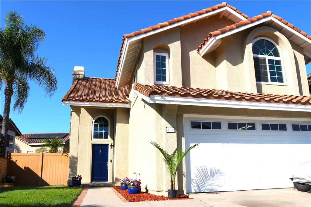 Located within walking distance to the serene RSM Lake and exclusive Beach Club and nearby O'Neill Park, this community offers residents a perfect blend of nature and recreation. Enjoy leisurely walks along the lake’s edge, spend sunny afternoons relaxing at the Beach Club’s resort-style amenities, or enjoy a hike among oak- and sycamore-lined hiking trails in O'Neil Regional Park with amazing views. RSM also offers 13 parks and 4 junior Olympic size pools with SAMLARC membership. Additionally, you will love the new Splash Pad in Central Park, providing a fun, safe, and refreshing space. Offering the best of outdoor living, Rancho Santa Margarita has been repeatedly rated one of the safest cities in California. This home has been fully renovated and is gorgeous inside; boasting all new luxury vinyl flooring, new carpet and new paint throughout. This home has approx. 700 extra square feet of space inside, you won’t want for space in this home. Walking in the front door you are greeted by a large living area with a new fireplace surround and an open layout into the kitchen. The stunning, gourmet kitchen has a walk-in pantry, custom cabinets, large island and granite countertops. It also boasts the best in appliances; from the Jenn-Air electric double wall ovens with convection, and JennAir convertible gas grill top, to the Samsung BeSpoke AI four door fridge. Off the beautiful kitchen is another bright room for dining, offering a large bay window and French doors to the backyard. The backyard has cement areas for outdoor dining/relaxing options and a large grass area. Upstairs there are two light and bright secondary bedrooms, and a huge primary suite complete with a wall of wardrobe cabinets, a custom bathroom vanity and a Schonbek crystal chandelier. The upstairs also has a large loft that could easily be converted to a fourth bedroom and office area. This home has all the space you could ever want in a highly desired neighborhood. To top off this large, renovated gem, a new garage door and motor were just installed this year. New garbage disposal in 2025, and an InSinkErator instant hot water dispenser. Exterior was painted in 2023. Rheem 50-gallon water heater installed in 2021. Newer vinyl fencing. Newer double pane windows. This is the home you’ve been waiting for!