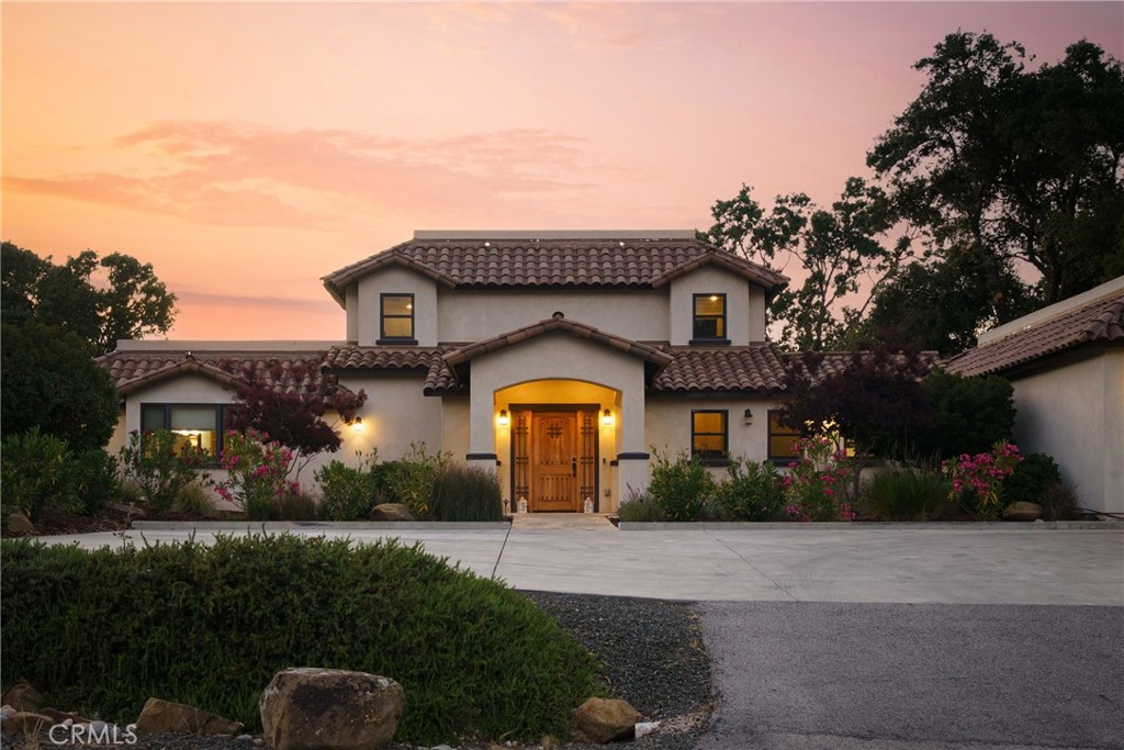 Welcome to your dream home in the highly sought-after Long Valley Ranch neighborhood of West Atascadero—where luxury, privacy, and style converge. This stunning custom estate blends timeless design with upscale modern amenities, offering approximately 2,784 sq ft of refined living space on a spacious and beautifully landscaped parcel situated on 7+ acres.
Step inside to discover carefully designed craftsmanship throughout, including new flooring, solid core doors, Marvin double-hung windows, and custom cabinetry. The heart of the home is a chef’s dream kitchen, complete with a massive center island, granite countertops, pot filler, and premium appliances by Dacor and Miele. The kitchen flows seamlessly into an inviting great room with custom built-ins and a bright dining area that opens to the breathtaking outdoor living space.
The main-level primary suite is a true retreat, featuring a spa-inspired en-suite bathroom with marble countertops, dual vanities, a soaking tub, and a walk-in shower with dual shower heads. A guest suite on the opposite side of the home offers privacy and comfort, with its own luxurious bathroom and walk-in closet—ideal for visitors or multi-generational living. Upstairs, you’ll find three more spacious bedrooms, each with walk-in closets, and a beautifully appointed full bathroom.
But the real showstopper? The incredible backyard oasis. Thoughtfully transformed in 2024, , this outdoor paradise features a brand-new ecoFINISH custom pool and spa, a built-in fire pit, and a sprawling entertainer’s patio. Whether you're hosting summer gatherings or relaxing under the stars, this turn-key property delivers resort-style living at its finest.
Additional highlights include a cross-fenced pasture for animals or hobbies, remote-controlled blinds, central vacuum, soft water and whole house filtration system, three-zone HVAC, nearly new Navien tankless water heater, and 7 ft deer fencing. All of this while still being only 5 minutes from San Anselmo and 101 interchange.
This is more than a home—it’s a lifestyle. Turn the key, step into luxury, and enjoy the best of Atascadero living.