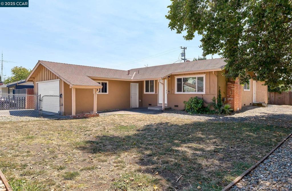 Absolutely Stunning! Check out this RARE updated 4 Bedroom, 2.5 Bathroom Skyline Terrace Charmer! This home features a modern kitchen with newer shaker cabinets, modern appliances, granite counters and more! Home also features laminate floors, new carpet in bedrooms, fresh interior paint, updated bathrooms, dual pane windows, 2" faux blinds, central heat, a cozy fireplace and more! Home also features a HUGE backyard with a large patio, possible RV access, just perfect for those family gatherings, summer BBQs and making memories! Better hurry and get your offer in quickly as this one is sure to go fast Offers will be presented as they come in.