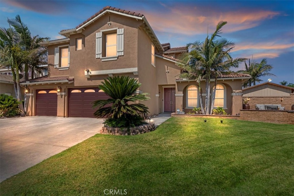 Welcome to Eastvale ~ come to find out all it has to offer! Here is your next home at 7213 Cottage Grove Drive. A cherished turnkey abode with great curb appeal that sits proudly on 8276 sq ft lot. This charming two-story residence boast ample space and comfort for all your living needs. There are 5 generously sized bedrooms and 3 full bathrooms, including a highly desired lower level bedroom and bath. This home blends practical living, desirable amenities and a great floor plan. The kitchen is the heart of the home, this one is has a spacious island and gleaming granite countertops. While cooking you'll appreciate the dual oven, gas stove top, dishwasher and space saving microwave. The lower level living space includes formal & informal living rooms (1 with gas burning fireplace), foyer entry, spacious laundry room, closet space and entrance from the 3 car garage. Upstairs you will find the owner's bedroom complete with large bathroom enjoying a sizable 2 door closet, dual sinks along with separate shower and tub. The other bedrooms on the 2nd level are all well-sized with the one serving currently as a TV/Study room due to the generous size. Step outside to the lovely backyard offering you more living space under an expansive covered patio plus an outdoor cooking area. Both sides of the rear yard has additional space. Adding to the property's appeal is a substantial shed or workshop; perfect for a Man Cave or extra space to store your belongs (Bonus Point: it has heating & AC). If you'd like to spend time enjoying your manicured front yard, there is room for a cozy conversation area. Check this out...you're going to Save Save Save = SOLAR IS OWNED (20 Panels) already PAID FOR & NO HOA! The current owners have added many convenient touches to this home that you will utilize & enjoy. All this offered at a great value! Put it on your list to come see for yourself. Once you do, you will fall in love with Eastvale. Located in the Award Winning Corona-Norco School district, Eastvale is a relatively young & thriving community offering several parks, a community center & dog park, plenty of shopping & restaurants, SilverLakes Sports Complex, plus trails along the Santa Ana Riverbed area. In addition, it is commuter friendly sitting near the 15 freeway with quick access to the 10, 60, 71 & 210. Within minutes you have convenient access to the Southern California region. Hurry - The Good Life is waiting for you!