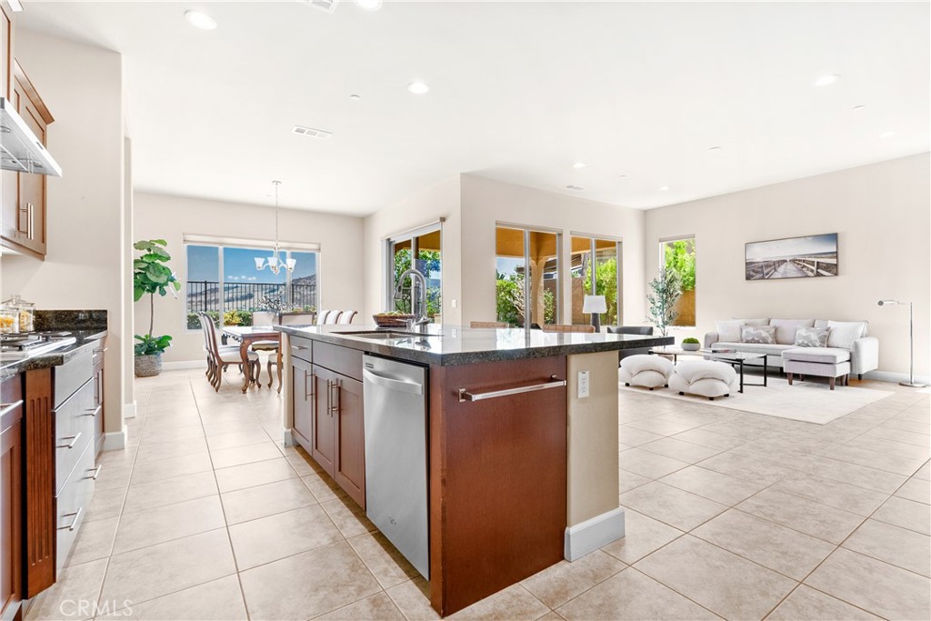 Welcome to refined single-level living in the exclusive gated enclave of Gavilan-Sendero. This exceptional 55+ Del Webb residence is tucked away on a serene cul-de-sac within Rancho Mission Viejo’s award-winning master-planned community, offering a harmonious blend of elegance, comfort, and Panoramic Views. Designed for both relaxation and entertaining, the expansive backyard is a private retreat featuring sweeping vistas, a built-in BBQ, spacious lounge and dining areas, and a covered patio perfect for enjoying Southern California’s indoor-outdoor lifestyle year-round. Inside, the heart of the home is the chef-inspired kitchen, where rich granite countertops, premium stainless-steel appliances, and an oversized island with a single-basin sink and bar seating create an inviting space for hosting or everyday enjoyment. The open-concept layout flows seamlessly into the dining and living areas, all bathed in natural light. The primary suite offers a true sense of retreat, complete with a spa-like bath that includes a deep soaking tub, a sleek frameless low-threshold shower, and a generous walk-in closet. A private secondary bedroom with its own en-suite bathroom ensures comfort for visiting guests. A dedicated office provides flexibility for work or hobbies. Additional features include homes only on one side of the street, full driveway with parking for two cars, backyard overlooks a park so your not overlooking another home, the office could be converted to a third bedroom, upgraded enlarged dining room area, custom window treatments, upgraded tile flooring throughout with plush carpeting in the bedrooms, a walk-in pantry, and built-in storage cabinetry in the garage. This home exemplifies thoughtful design at every turn, all within a vibrant, amenity-rich community. Beyond the home, you’ll enjoy a vibrant, resort-style lifestyle with exclusive access to private Gavilan 55+ amenities — including The Perch, The Hacienda, The Outlook, The BBQ Barn, and The Getaway. Stay active and connected with a state-of-the-art fitness center, saltwater pool, spa, cabanas, bocce ball courts, yoga studio, fire pits, and social lounges. And when the grandkids visit? You’ll have full access to Rancho Mission Viejo’s award-winning all-ages amenities, arcade, community farms, fitness centers, indoor basketball gym, putting green, Sports park, tennis and pickleball courts, parks, and events that make this community unlike any other.