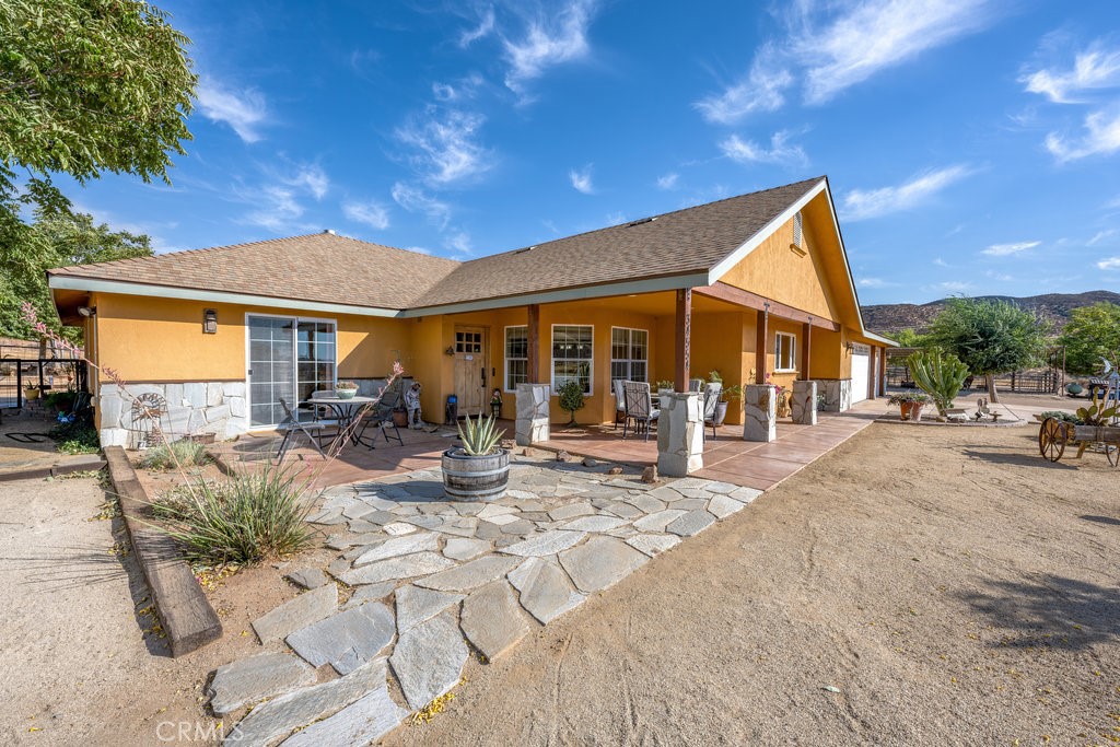 Welcome to 34554 Koontz Road Agua Dulce, just minutes away from Santa Clarita. This private custom single story horse property features 3 bedroom and 2.5 baths with spectacular views of the canyon and mountains. There is plenty of room for ALL of your toys, RVs, motorcycles, horses etc. The kitchen features beautiful views from your large kitchen window over your kitchen sink, plenty of cabinet space, granite counter tops a center island, custom cabinetry and easy care cement flooring that carries into the living and separate dining area. The living room has a large custom fireplace built with flagstone and doors that lead out to your covered patio to enjoy the views. The primary suite also has its own private access via slider doors to access the outside to enjoy the views and ensuite features a jetted tub and separate shower. extra large 3 car garage. All this on almost 1 acre of property with remarkable views in a serene and private setting of low maintenance grounds and that has been meticulously groomed for fire safety.