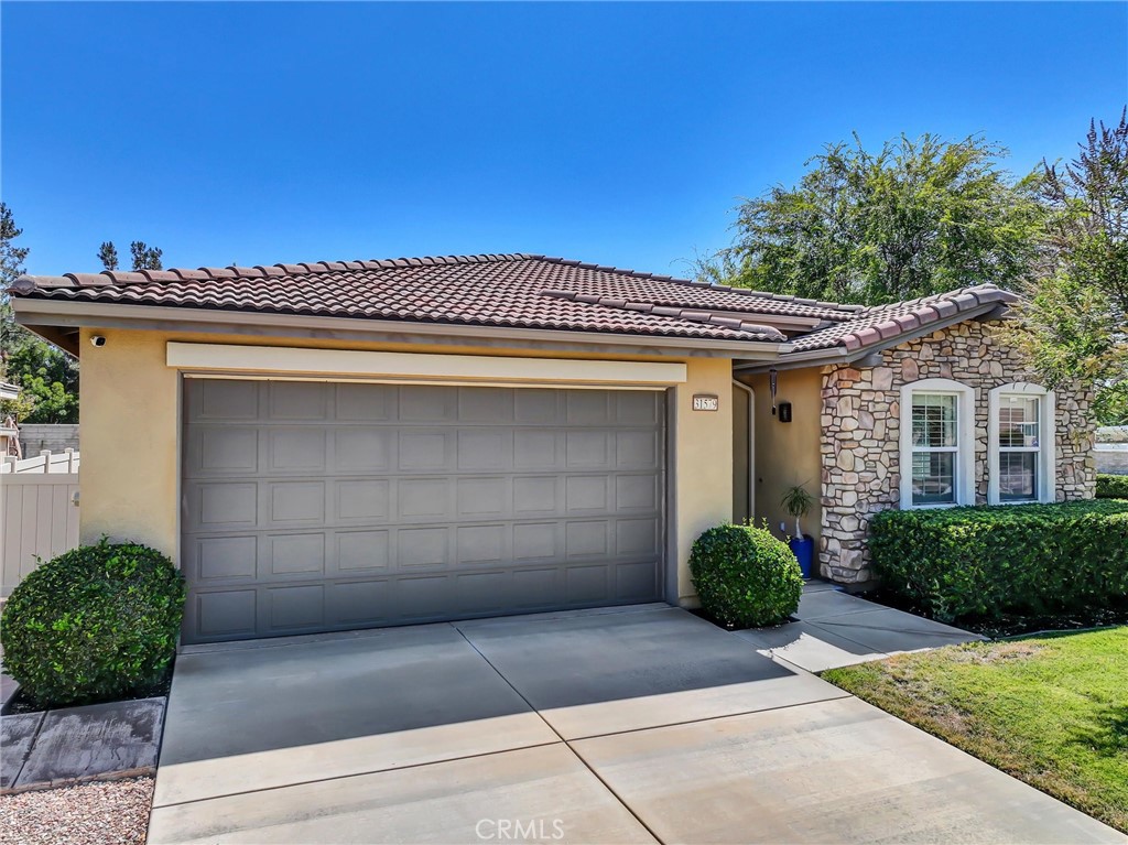 Popular single-story home on a Corner Lot with Open Floorplan. No rear neighbors! 3 Spacious bedrooms & 2 bathrooms. This home is in pristine condition and shows true pride of ownership. Enter through a lengthy hallway with high ceilings that opens up to the Open Great Room. The beautiful gourmet kitchen features generous cabinets, a large island ,stainless steel appliances, and granite countertops. New 2025 Stove, Garbage disposal and Water Heater! Spacious open Great Room with surround sound system & cozy fireplace with raised hearth is the perfect place to entertain. Primary suite is on one side of the home, separating you from the other 2 bedrooms. Primary bathroom with a Separate walk in shower and soaking tub, generous walk-in closet and dual sinks & vanity! There is also a huge walk in closet! Secondary bedrooms are large , one featuring a Barn Door entrance! Additional features include an Indoor Laundry room with storage cabinets, Plantation Shutters, Ceiling Fans and beautiful oversized 20" tile flooring throughout the living spaces. Laminate flooring in bedrooms. Outside, the backyard features a fully landscaped, low maintenance yard with no rear neighbors! Pick your own fruit from the lemon & lime trees! Large covered alumawood patio cover, with custom hardscape, and show stopper built in fire pit with fire glass. Block wall fencing, with vinyl fencing on one side. Extra large 2 1/2 car garage! Located in the award-winning Temecula school district, in the Dutch Village neighborhood near sports parks, playgrounds, walking trails and shopping, this home has it all! This is a serene quiet location with amenities nearby and Temecula wine country only minutes away! LOW Taxes! and LOW HOA, only $10/month ($120 for the whole year)!