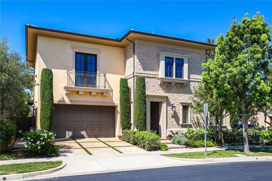Ideally located on a premium corner lot in the prestigious 24-hour gated community of Orchard Hills, this stunning FORMER MODEL HOME showcases over $500,000 in ultra-premium designer upgrades. Designed for both luxury and convenience, the residence features two master suites (one downstairs and one upstairs), a guest bedroom on the main level, and a spacious upstairs entertainment loft. From the moment you enter, the soaring foyer with its high ceilings and wide arched passageways sets the tone for sophistication, while the open-concept floorplan creates a seamless flow for everyday living and entertaining. The expansive great room connects effortlessly to the dining area and chef’s kitchen, where accordion-style bi-fold doors open wide to blend indoor and outdoor living. The impeccably designed kitchen boasts an oversized Caesarstone quartz island, sleek cabinetry with modern hardware, full backsplashes, designer light fixtures, and top-of-the-line Sub-Zero, Wolf, and Bosch appliances. In addition to the main kitchen, a fully equipped prep kitchen provides extra space for cooking and entertaining, making it an entertainer’s dream. Glass doors off the great room lead to a California Room and beautifully landscaped backyard, complete with a fireplace and mature trees, perfect for gatherings with family and friends. Additional highlights include luxurious Walker Zanger Bronzon porcelain floors, 10” baseboards, plush carpet upstairs, Designer window treatments, and walk-in closets with custom shelving systems. This turn-key home is complemented by Orchard Hills’ world-class amenities: multiple pools, a clubhouse, parks, hiking trails, basketball and tennis courts, and proximity to award-winning schools and the vibrant Orchard Hills Shopping Center. Don’t miss this rare opportunity to enjoy resort-style living in one of Irvine’s most prestigious neighborhoods!