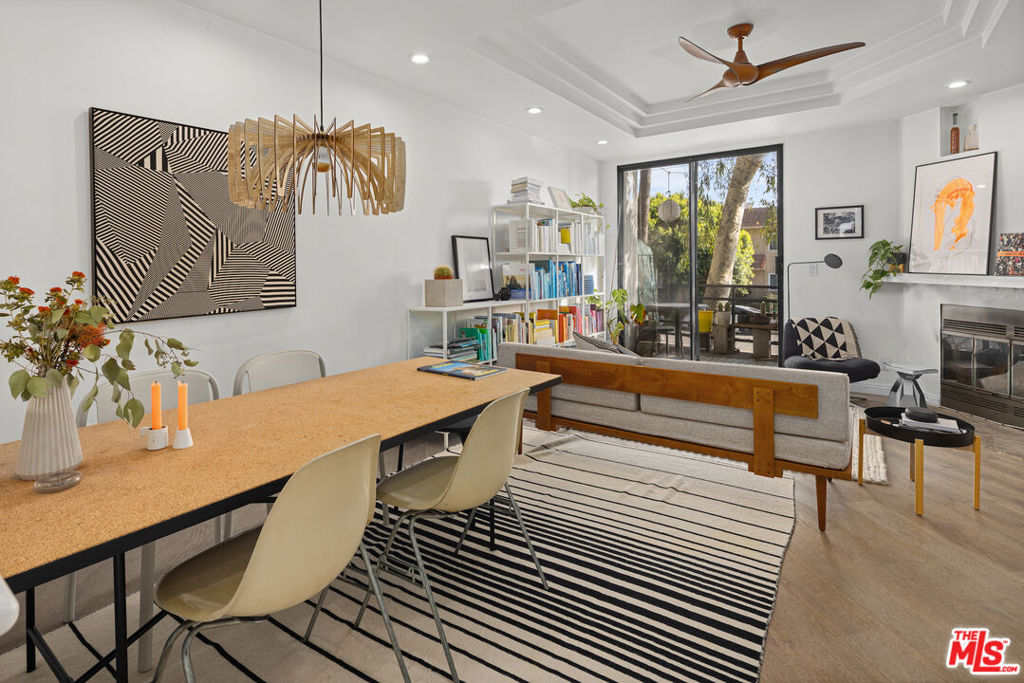 Experience the quintessential Venice lifestyle in this stylish 2-bedroom, 2.5-bath townhome condo on the iconic Abbot Kinney Boulevard. Just moments away from Venice Beach, Washington Boulevard, and an endless array of boutique shops, dining, and Silicon Beach Tech offices, this home offers a blend of modern comfort and coastal convenience. The main level features an inviting open floor plan with hardwood floors, recessed lighting, and a corner fireplace that adds warmth and character to the living area. A private patio extends the living space outdoors perfect for morning coffee or evening relaxation. The kitchen is equipped with stainless steel appliances, sleek countertops, and ample cabinetry, flowing effortlessly into the dining and living areas. A half bath on this level adds everyday convenience. Upstairs, find two ensuite bedrooms, each offering privacy and comfort with wall-to-wall mirrored closets and bathrooms. Additional highlights include central HVAC, in-unit washer and dryer, and secured garage parking for two vehicles plus guest parking, and dedicated storage. Located in a secure-access building in one of Venice's most desirable neighborhoods, this townhome is the perfect blend of style, location, and lifestyle.