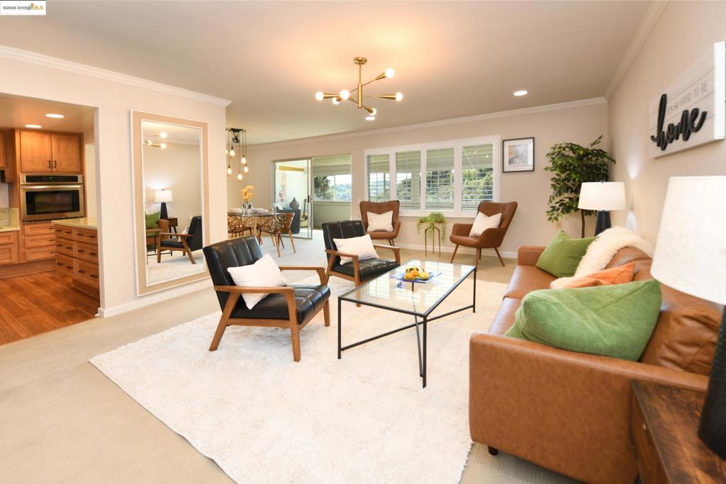 Currently rented thru April 1, 2026. Fully furnished for travelers, including 75 inch flat screen TV, WI-FI, bedding, towels, kitchenware and brand new washer/dryer. Flexible lease must be over 30 days. This is a 55 and over community. This recently remodeled condo offers resort living at its finest. Tennis, golf, bacci ball, three swimming pools, professional grade arts and crafts studios, 200+ clubs, lectures, concerts and a state of the art fitness center are just some of the wonderful extras offered at Rossmoor Walnut Creek's famous 55+ gated community. The single-story layout ensures easy accessibility and convenience. New recessed lighting, light fixtures, double pane windows,  water heater and HVAC give this Rossmoor home the up to date modern connivences we all want while the crown molding and California shutters supply a comfortable easy-living style. The enclosed patio provides stunning panoramic views and almost 200 extra square feet of living space. The kitchen boasts stainless steel appliances, custom cabinets and recessed lighting. Two skylights provide natural lighting in the entry hall and bathroom. Assigned covered parking space #5. Explore the vibrant local community by visiting the nearby farmers market.