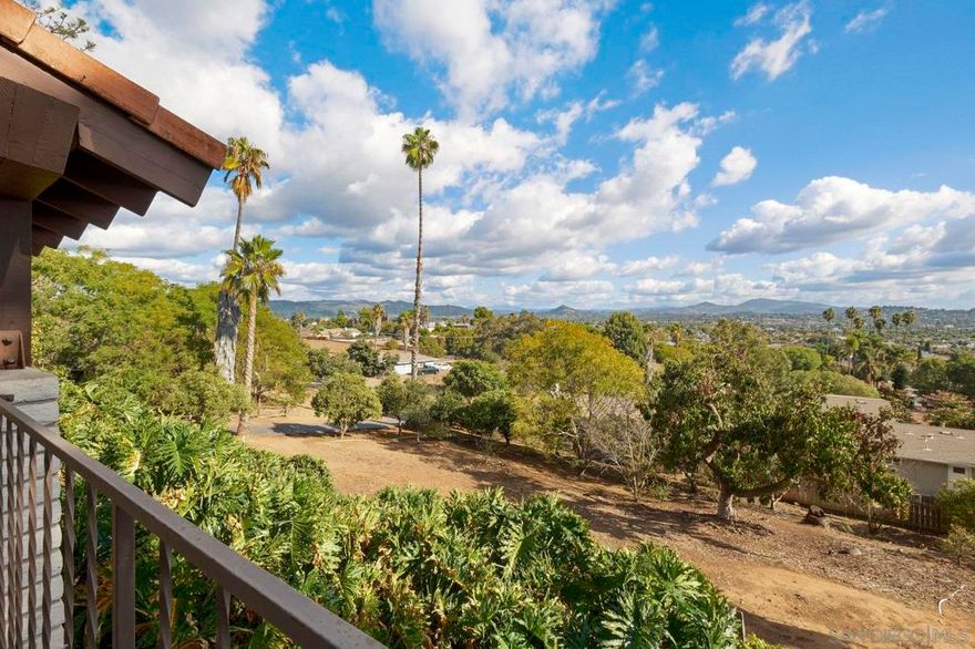 Hidden sanctuary with sweeping views.  Escape to panoramic serenity in this custom-built 3+ bedroom, 2.5 bathroom estate, quietly nestled on a private road yet just moments from town. Set atop 1.45 acres, this home offers commanding views that stretch across rolling hills-a daily backdrop of sunrise splendor and sunset tranquility.  Thoughtfully maintained by one family for many years, the residence exudes pride of ownership and enduring charm. Step inside to freshly painted interiors and the comfort of a new AC system. The main-level primary suite features breathtaking views and an ensuite bath, while generous secondary bedrooms provide space for family or guests. A formal dining room-previously used as a fourth bedroom-offers flexible living options to suit your lifestyle.  Outdoors, the opportunities are vast. Envision an infinity-edge pool overlooking the valley, an ADU for multi-generational living or luxury rental income, or create a private vineyard. The property’s mature citrus trees-orange, tangelo, lemon, and tangerine-invite al fresco gatherings and orchard-to-table living.  From the expansive front porch to nearly every room inside, the views take center stage, creating a haven of peace, privacy, and potential. A rare offering for those seeking a legacy property with room to dream.  A home to cherish. A canvas to create. A view to keep forever.  A rare property on a buildable lot. This is the one you've been waiting for!