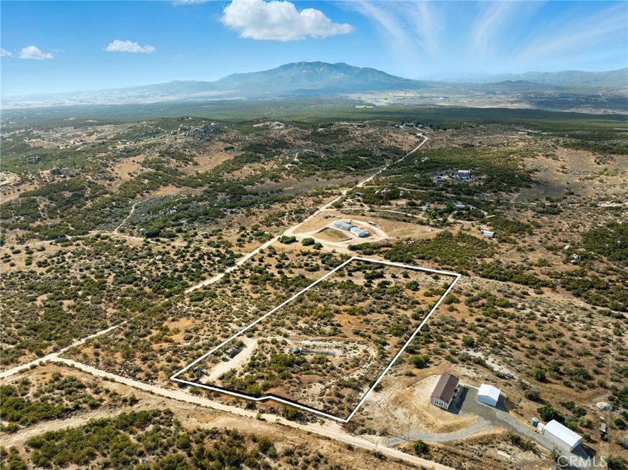 Discover an extraordinary opportunity to own fully fenced and improved 4.8 acres in the scenic hillsides of Upper Aguanga. This private and mostly usable parcel offers panoramic views and endless possibilities, all while being just 40 minutes from Temecula or Idyllwild.

The property features a private well with pump and pressure tank (installed in 2006), electricity on site, and newer fencing already in place. Zoned R-A-5, it's an ideal setting for a custom home, horses, animals, gardens, or a small ranch.

Enjoy the peace and privacy of rural living with the convenience of accessibility. Whether you're ready to build now or invest for the future, this is a rare opportunity to own a beautiful piece of Southern California countryside.