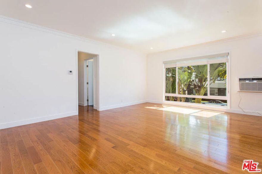 Discover modern comfort in this West Hollywood apartment spanning 1,200 square feet. The two-bedroom layout offers en-suite, spa-like bathrooms finished with Italian porcelain tile and frameless glass enclosures. The kitchen is outfitted with stainless steel appliances, sleek cabinetry, and refined countertops. Hardwood floors, recessed lighting, and high ceilings create an open, light-filled atmosphere throughout. Additional features include in-unit private laundry, dual-pane windows for improved sound and temperature control, wall air conditioning, generous closet space, Hunter Douglas window treatments, and updated electrical wiring suited for today's technology needs. Rent includes water and trash, along with one covered parking space. This is a rare opportunity to enjoy refined living in the heart of West Hollywood. Schedule your private showing today.