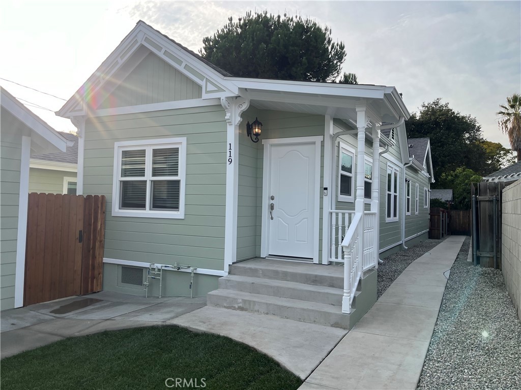 Welcome home to this beautiful 3 bedroom 2 bathroom home in the heart of North Monrovia. This Victorian character house was lovingly updated with efficiency and functionality in mind. As you enter the home you are greeted with the original working gas fireplace complete with ceramic logs. Continue through the arched doorways into the light dappled kitchen with newly installed quartz counters and gorgeous custom-built cabinetry. Wake up and have breakfast at the spacious kitchen island. If you enjoy entertaining the adjacent formal dining room with vaulted ceilings and access to the backyard is ideal. Other features of the kitchen are an eat-in area, soft close cabinet hinges, and custom workspace built-ins for conveniently working from home. Proceed down the hallway to find a laundry area that is located centrally between the bedrooms with a laundry room sink and extra storage. The guest bathroom is gorgeous and bright with a timelessly elegant clawfoot bathtub. Built-in cabinetry was strategically placed outside the bathroom for linens. The primary bedroom is located in the back of the house. Natural light fills the room from the sliding glass doors that lead to the spacious newly installed private grass backyard. Storage will not be an issue in this room with 2 closets on either side of a quaint hall to the bathroom. The primary bathroom is luxurious with a walk-in shower and quartz countertops. The 2 guest bedrooms are also full of light, nicely positioned and sized, and offer plenty of storage. This home has central heat and air, dual paned windows, and was freshly painted both inside and out. The home also has custom fit blinds, and parking for a single car. The location is perfect for a stroll to the Farmers market on Friday nights or to try a new restaurant. Commuting is a breeze with easy access to the 210 and the 605 freeways.