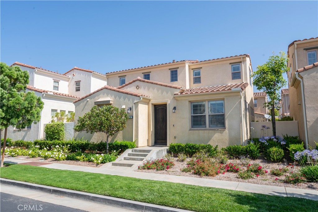 Welcome to this gorgeous 2 bedroom/ detached residence located in the prestigious & gated community of Cortile. Upon entering this masterpiece, you are greeted by custom floors. The cook's dream kitchen offers granite counters, stainless steel appliances, dark cabinets & plenty of cabinet space. The large living room and adjoining dining area offer upgraded flooring & they are perfect for entertaining & family gatherings. Upstairs you will find 2 large bedrooms, including an impressive master suite. The Master suite features a large walk-in closet, dual sinks, upgraded counters & floors. Also upstairs is a convenient laundry area. Travel outside to find 2 private patios...perfect for entertaining & Summer BBQs. 2 car attached garage. Ceiling fans in living room & each bedroom. Custom window treatments. Located in the award-winning Porter Ranch Community School K-8 (per LAUSD website. Buyer to verify). The community of Cortile offers a sparkling & inviting community pool area, perfect for summer! Attractive HOA dues. Want an added bonus? Cortile is located close to the new Vineyards shopping center, which boasts great restaurants such as Lure, Patxi's Pizza, Finney's Gus BBQ, a Whole Foods, state-of-the-art AMC theater, Nordstrom Rack & more. If you want to the best of Porter Ranch, it's all here!