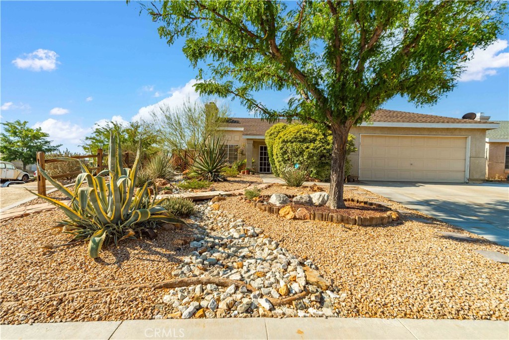 You will not want to miss out on this stunning ''Desert Oasis''! This beautifully maintained landscape is ''all that'' and more. Step inside to a bright and welcoming 3 bed 2 bath home that offers the perfect blend of comfort and easy maintenance. Ideal for the first time homebuyer and features a beautifully designed xeriscape yards(low water, low maintenance)which allows you to enjoy the outdoor space without the hassle. Inside you'll find a warm and inviting layout, functional kitchen that opens to the backyard. The rooms are comfortable in size with 2 full bathrooms. The 2 car garage is attached and sizable for the laundry area. The driveway has extra space for an additional vehicle .The location is convenient for work on base and local shopping. The 14 freeway is near by for a quick trip anywhere. Don't miss your chance for this little gem!