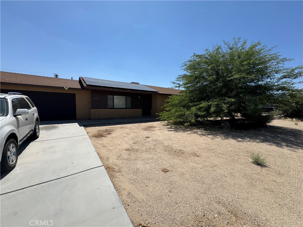 All you want is an affordable home. This could check the boxes. Located on the east side of town with easy Base and highway access. This wonderful home has financed solar panels for low electric bills (maybe no electric bills?). All tile floors. Larger bedrooms. Two bathrooms. Fenced back yard has an above ground pool that is currently not functional. Well organized kitchen space. Dining area is open to the family room. Two car garage. The house has a water purification system that costs thousands and is included in the price. Great location and great price should put this home at the top of your list. Easy to show. Plan a visit today!!