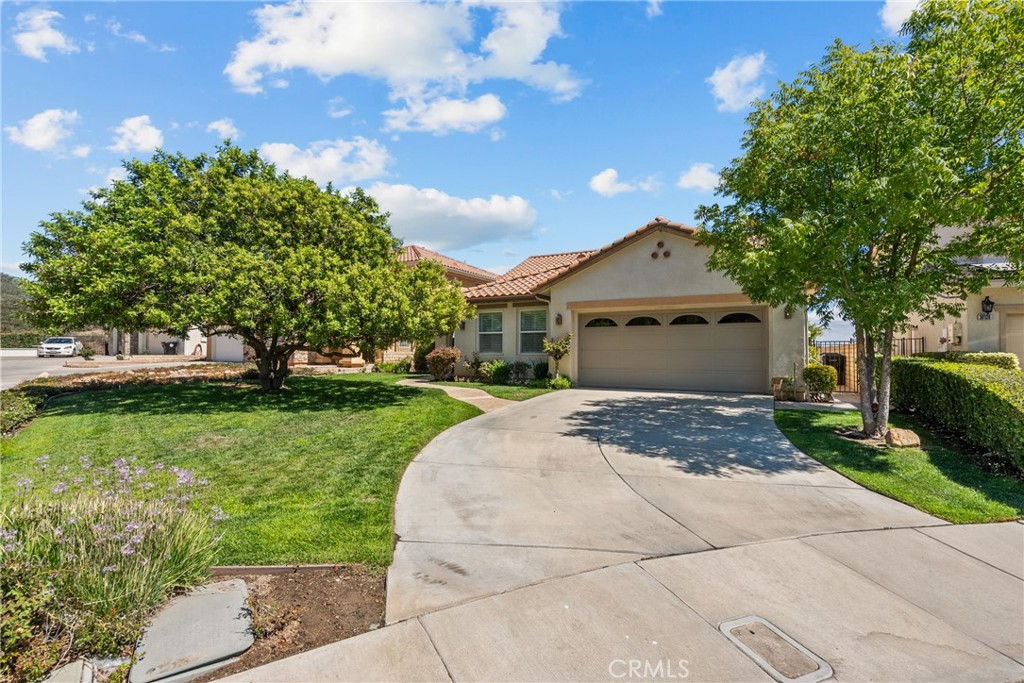 Tucked away on a quiet cul-de-sac, this stunning home combines comfort, functionality, and breathtaking views. Step inside to find a bright and spacious layout featuring wood floors, crown molding, recessed lighting, and elegant finishes throughout.
The formal living and dining areas set the tone for entertaining, while the open-concept kitchen boasts granite countertops, a center island, and abundant cabinet space. It flows seamlessly into the family room, complete with a cozy fireplace and large windows framing sweeping mountain views.
On the main level you'll find a luxurious primary suite with wood flooring, a walk in closet, and a spa-like bathroom featuring dual vanities, soaking tub, and a walk-in shower. Upstairs, you’ll find two spacious bedrooms, In addition, on the first floor the home offers a versatile den that can easily be used as a 4th bedroom, office, or playroom.
The backyard is perfect for entertaining or unwinding, with a covered patio, built-in BBQ, and expansive views of the valley below. Additional highlights include a convenient upstairs laundry room, ample storage, and a two-car garage.
Ideally located near schools, parks, shopping, and freeway access, this Castaic gem offers both tranquility and convenience.