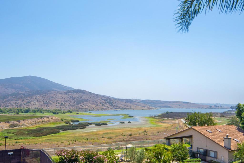 Incredible sweeping views of Sweetwater Reservoir and the surrounding mountains fill nearly every room of this inviting home. The open floor plan with vaulted ceilings creates a bright, airy atmosphere, complemented by new carpet, polished tile and upgrades throughout the home. The primary bedroom features a private deck with panoramic views—perfect for morning coffee or evening sunsets. Enjoy low HOA dues and access to desirable community facilities, making this home a rare blend of comfort, style, and value.