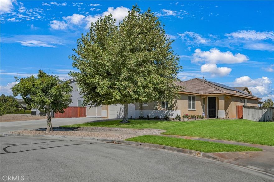 Fantastic new listing in the Beautiful, Oak Hills area of Hesperia. If you're looking for a spacious, single level home with low maintenance side/back yards and huge RV parking, then look no further! This home has recently undergone an expansive exterior upgrade. The massive, gated RV parking has been updated from dirt/gravel to CONCRETE, complete with its own RV clean out access that's connected directly to city sewer! The back yard beautification includes new, low maintenance, drought resistant turf, perfect for your furry friends. Yard is also equipped with a large, covered patio, great for hosting outdoor gatherings. The home boasts 4 bedrooms and 2 bathrooms with over 2000 sqft of single level living area, which recently had NEW VINYL FLOORING installed throughout the entire home. The open concept living and kitchen area with an over-sized island lends itself as the perfect gathering point for any occasion. Make your way down the hallway and you'll see 3, generously sized bedrooms and 1 bathroom. Make your way to the end of the hallway and you're greeted by your enormous primary bedroom, complete with a vast, primary bathroom and spacious walk-in closet. With this home you don't need to worry about the costly electricity bills from running your central AC during those hot, summer months or charging your electric vehicle with the included TESLA CHARGER as this home comes fully equipped with a SOLAR PRODUCTION SYSTEM. Production covers 100% of the current owners monthly electricity usage. This home is a fantastic opportunity and will not last long.
