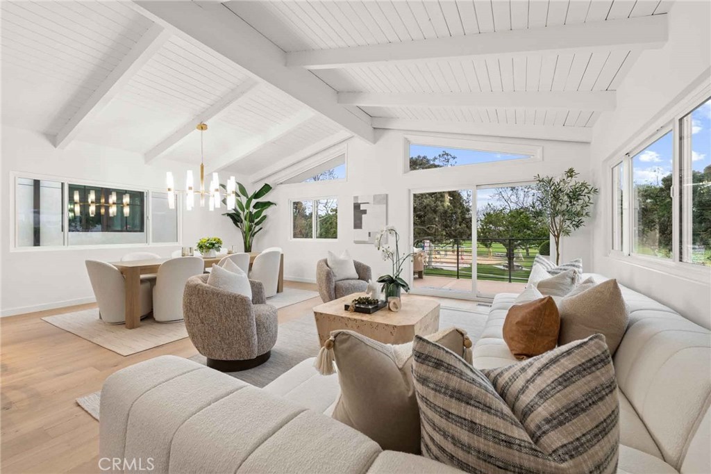 This recently renovated, south-facing single-family home is situated in North Hermosa Beach, just a few blocks from the beach. The property, located at 441 Gould, exemplifies the ideal coastal lifestyle. It provides an excellent environment for both entertaining guests and those seeking a serene retreat, offering an optimal combination of space, light, and luxury. The upper level of the residence is expansive and welcoming, featuring an oversized family room and a dining area with cathedral ceilings. At the rear of this level, you'll find a spacious master retreat that features a private patio. Large sliding doors open onto a secluded, south-facing front terrace ideal for enjoying the coastal breeze. The first level features two well-lit bedrooms and a full bathroom, allowing for an abundance of natural light. Additional features of this property include central air conditioning, ample parking space, and extensive storage options. It consists of a laundry room, a two-car garage, and two coveted covered parking spaces located outside the garage, resulting in a total of four parking spaces—a notable advantage in this area.
Furthermore, the home overlooks Valley Park, providing a conducive space for families. It offers opportunities to stroll with children or dogs, or to relax on one of the numerous benches or picnic tables. This property is worth considering for those interested in coastal living.