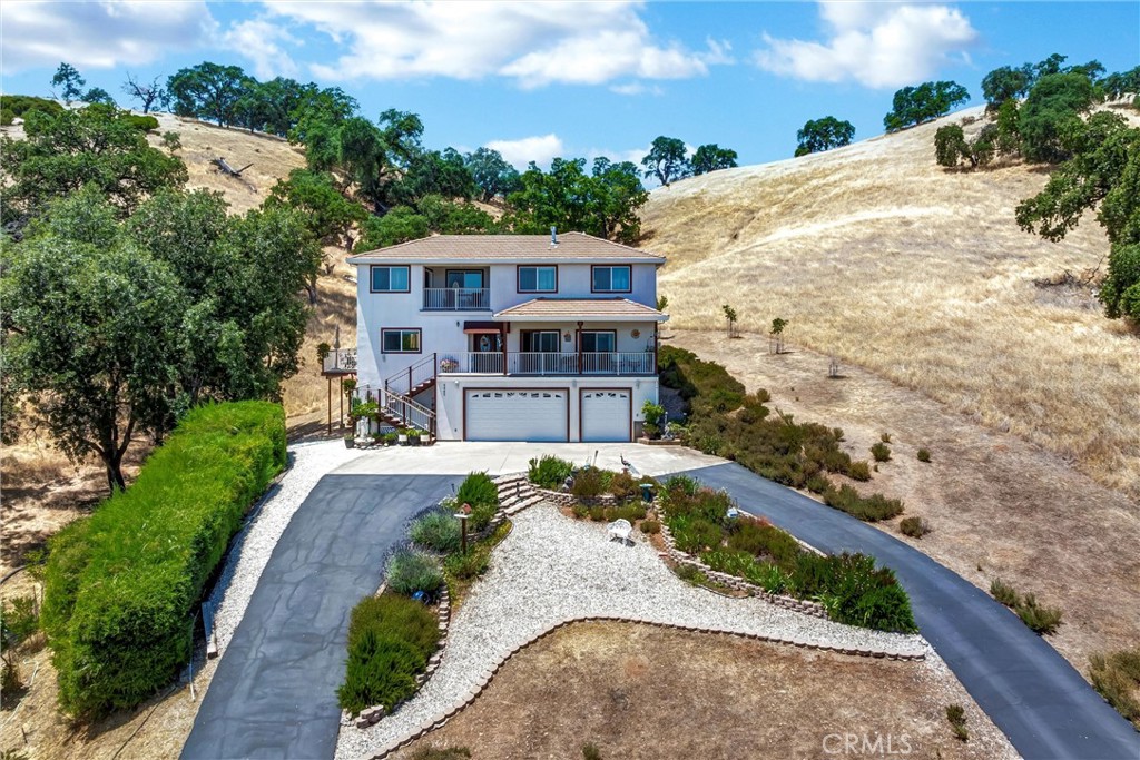 Expansive 3-Level Home with Breathtaking Views of Clear Lake & Mt. Konocti!
Welcome to this stunning 3-level home offering 2,831 square feet of well-designed living space on 1.29 oak-studded acres. With 3 bedrooms, 3.5 bathrooms, and spectacular views from nearly every room blending comfort, space, and natural beauty.
The lower level offers an oversized 3-car garage and a flexible bonus room with a half bath—ideal for a home gym, hobbies, games, or a quiet workspace.
On the main (second) level, you’ll find a bright living area with two sliding glass doors to take in the view and access the large covered deck. A well-appointed kitchen with tile flooring, granite countertops, stainless steel appliances, and a sink window with stunning lake views. This level also offers a large bedroom with full bathroom, laundry room, and access to multiple decks—perfect for entertaining, BBQing, or enjoying the peaceful setting and occasional wildlife.
The upper level is home to a luxurious primary suite with a dual-sided fireplace, sitting area, enormous walk-in closet, jetted bathtub, and walk-in shower. A separate room with direct access from the primary suite offers the perfect space for a home office, nursery, or private retreat. An additional third bedroom on this level features an en-suite bathroom. Both bedrooms access the covered balcony, where you can relax and enjoy the lake breeze. Start your day watching the sunrise over the lake and majestic Mt Konocti!
The horseshoe-shaped paved driveway is lined with established, mostly drip-irrigated landscaping, fruit trees, and a vibrant wall of purple lavender. Enjoy a level parking area, custom tile hardscape, bubbling fountains, and spring bulbs just waiting to bloom—this outdoor space is both elegant and inviting.
Located just minutes to downtown Lakeport this exceptional home offers a blend of space, luxury, and natural beauty—perfect for those seeking peaceful, elevated living with views that inspire.
