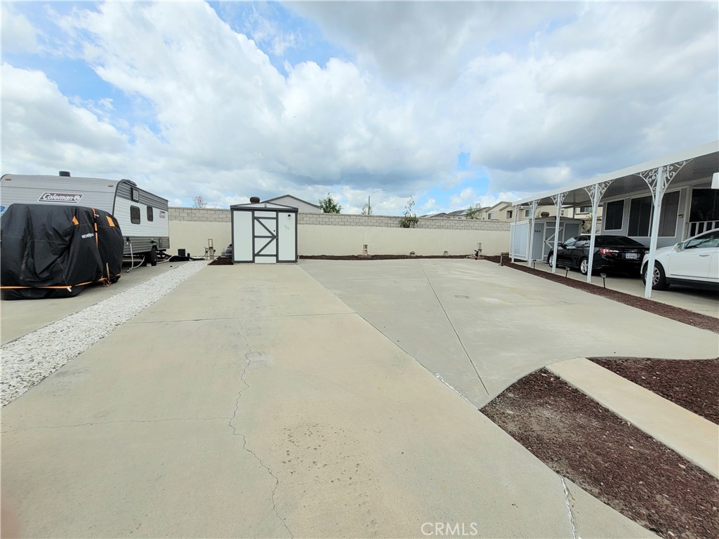 Welcome home to Mountain Shadows 55+ Resort community. Come FALL IN LOVE with this VERY RARE supersized A lot with shed and partial utilities. Live full time or snowbird in this beautiful community with wide streets and so many luxury amenities. You OWN the land beneath your home with NO space rent. This fun and friendly location has been landscaped and fence installed behind it for privacy. Entertaining here is easy with clubhouse nearby as well as additional guest parking. This fantastic active 55+ community includes 2 separate clubhouse areas with full kitchens, a salt-water pool, 2 spas, 2 gyms, 3 laundry areas, including lots of monthly community, seasonal and special entertainment with live events, clubs/ socials/ dances. HOA is only $244/month and includes water, sewer, trash, basic cable and internet for a GREAT value. Mountain Shadows is conveniently located near Temecula Wineries, Old Town, shopping, medical and so much more. Your scenic Oasis awaits you!
