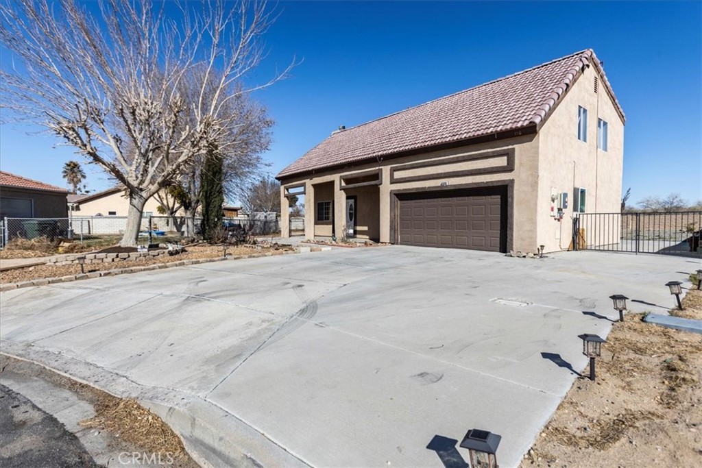 Experience the best of Silver Lakes living in this stunning two-story home, offering 3 bedrooms, 2.5 bathrooms, and an expansive 11,142 sq. ft. lot with ample space for RV and boat parking. This property is perfect for those who love both the tranquility of lakefront living and the excitement of outdoor adventures in the High Desert. As you step inside, you are greeted by an open floor plan that seamlessly connects the kitchen, living room, and dining area, creating a spacious and inviting atmosphere. Natural light pours into the home, enhancing its warm and welcoming feel. Double doors lead to your expansive backyard, offering the perfect setting for entertaining, relaxing, or customizing the outdoor space to fit your lifestyle.
The kitchen is designed for both functionality, featuring ample cabinet storage, a pantry for extra convenience in laundry room, and generous counter space ideal for preparing meals and hosting gatherings. Just off the kitchen, you’ll find your very own dedicated laundry room, making daily chores effortless and keeping your home organized. Upstairs, the master bedroom serves as a private retreat, boasting plenty of space, large windows for natural light, and its own en-suite master bathroom. The additional bedrooms are well-sized, providing comfort and flexibility for family members, guests, or even a home office. Beyond the home itself, Silver Lakes offers an exceptional community lifestyle with a variety of amenities. Residents enjoy access to private lakes with beach areas, an 18-hole golf course, a community pool, spa, tennis courts, walking trails, and even an equestrian center for horse enthusiasts. There is also an RV park within the community, perfect for those who have family members visits. For outdoor adventurers, this home is perfectly situated near off-roading trails, fishing spots, and kayaking areas, providing endless opportunities to explore and enjoy nature. One of the biggest perks of this property is its oversized yard, offering plenty of space to store all your recreational vehicles, toys, and equipment. Whether you love boating, off-roading, or simply having extra outdoor space, this home delivers it all. Don’t miss out on this incredible opportunity to own a home that perfectly blends lakefront serenity with desert adventure in the highly sought-after Silver Lakes community!