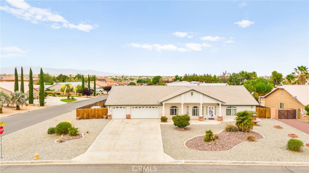 This beautifully maintained single-story home sits on a generous corner lot of nearly half an acre. Featuring 5 bedrooms and 3 bathrooms, the layout is thoughtfully designed for multigenerational living, with the primary suite and two bedrooms on one side and two additional bedrooms on the opposite wing. Interior highlights include ceiling fans throughout, two fireplaces, and brand-new kitchen appliances—refrigerator, stove, and dishwasher—all included. The primary suite offers dual closets and direct access to the backyard. Comfort is enhanced by two separate AC units, each serving one side of the home. The exterior boasts a covered deck, manicured landscaping, and a storage shed. A spacious 3-car garage and oversized driveway provide ample parking, including potential RV space.
Located in a convenient Apple Valley neighborhood near shopping, schools, parks, and entertainment. Must see!!