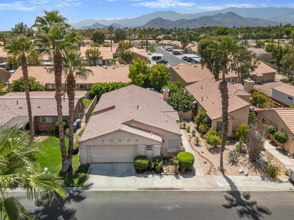 Welcome to your dream home in the heart of Palm Desert's highly sought-after Golden Sun Estates! This beautifully maintained 3-bedroom, 2-bath residence combines comfort, style, and convenience in a gated community designed for modern living.Step inside to a spacious family room with a cozy fireplace, perfect for relaxing or entertaining. The kitchen boasts sleek stainless steel appliances, making meal prep a breeze. Outside, enjoy your own private backyard retreat featuring two mature fruit trees--fig and tangerine--ideal for fresh-picked treats and weekend BBQs.The 2-car garage provides ample storage, while the community itself elevates your lifestyle with two sparkling pools and spas, a clubhouse for gatherings, and sport courts for recreation. Golden Sun Estates is an all-ages, serene enclave with no traffic noise--yet just minutes from world-class shopping, dining, golf, and quick I-10 access to all desert communities.Bonus: Enjoy all of this with very low HOA fees--a rare find in Palm Desert!This home is the perfect blend of tranquility, convenience, and value. Don't miss your chance to own a piece of Golden Sun Estates!