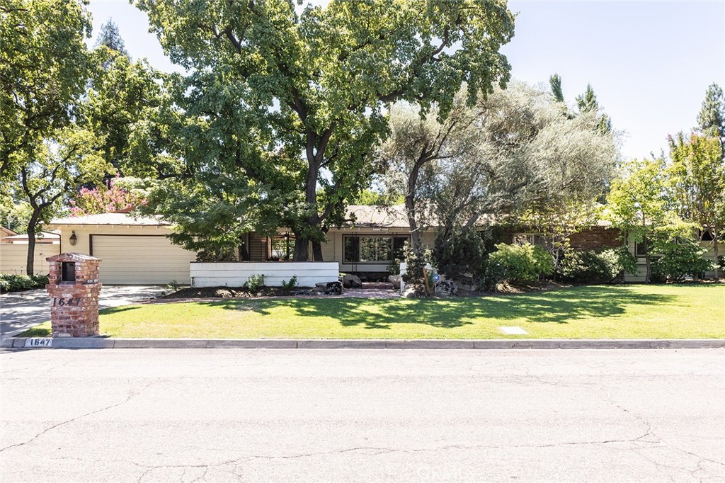 Welcome to the Bullard Neighborhood! This classic California property has been updated enough to give you modern elegance without feeling cold and sterile. Walking up to your new home, the front garden and entry way will show off beautiful landscaping with a little extra privacy courtesy of the partially enclosed courtyard. The kitchen and living room are warm and inviting, and just open enough to keep the conversation going with family and friends. There is an office that could also be a formal dining room. The primary bedroom features a large closet and vanity area, as well an exit into the zen garden. You can enjoy the tile and engineered hardwood flooring for years to come. The back yard is expansive and eye catching, with mature crepe myrtles and a stunning ginkgo. The 2 car garage also features a custom rock climbing wall inside. This is the one you've been looking for!