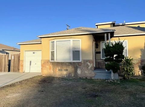 Photo of 1118 S Exmoor Ave, Compton, CA 90220 (MLS # OC26036643)