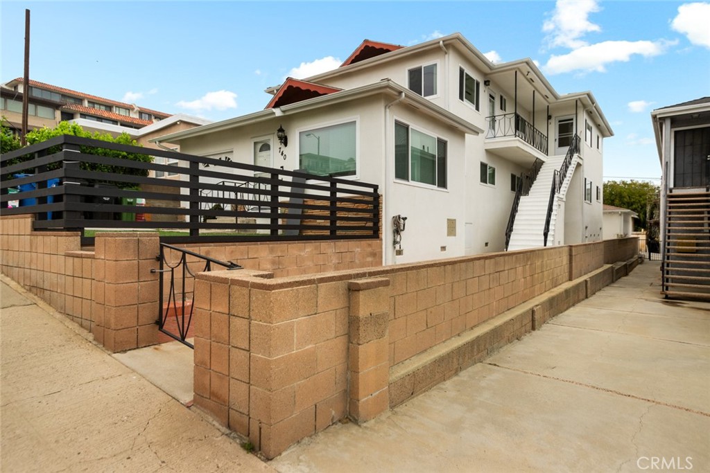Stunning 2-bedroom, 1-bathroom upper unit with spectacular views in desirable Point Fermin area of San Pedro. This exceptional residence features fresh paint throughout, new flooring, updated windows, and refreshed kitchen and bathroom with original cabinetry professionally repainted. Unit includes all appliances: refrigerator, stove, microwave, and washer/dryer. In-unit laundry area and private single-car garage. Enjoy breathtaking coastal views from the spacious living and family room areas, plus access to shared upstairs patio space. As the second largest unit in this quiet, well-maintained quadruplex, this home offers premium living with panoramic vistas. Located minutes from Cabrillo Beach, Point Fermin Park, downtown San Pedro attractions, and easy freeway access via Harbor 110. Small pets 20 pounds and under welcome. Exceptional opportunity in one of San Pedro's most sought-after neighborhoods.