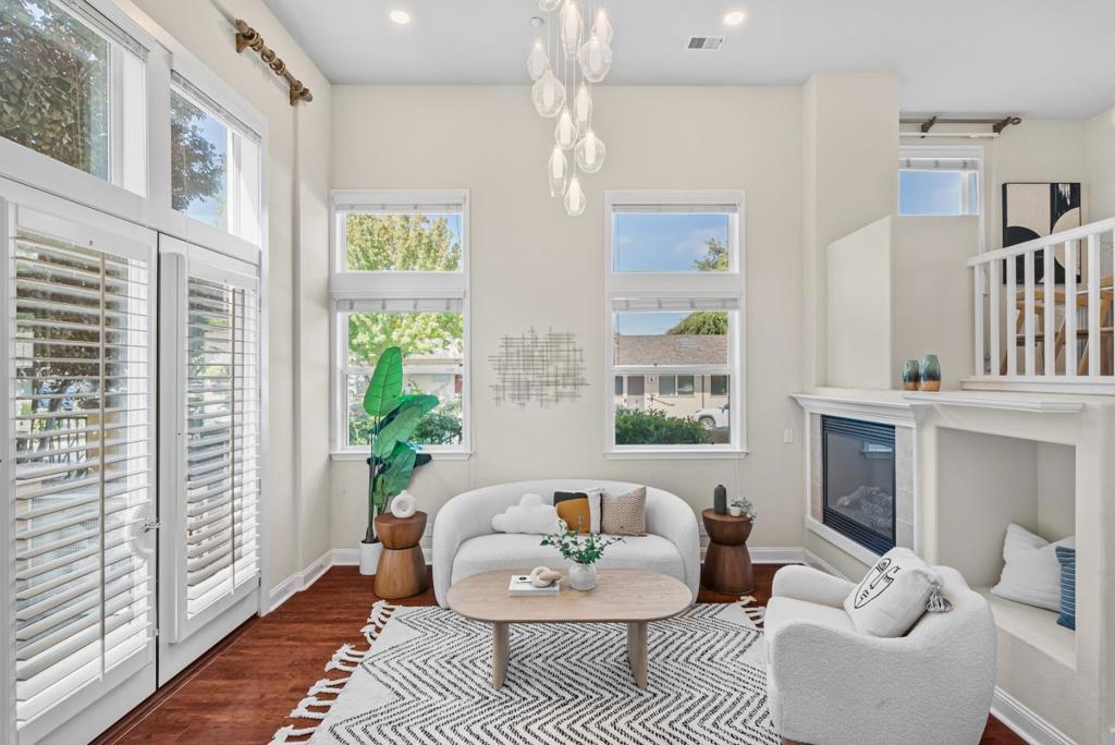 Luxurious, modern California lifestyle at the 'Siena at Saratoga' oasis nestled in West San Jose! This Toll Brothers end-unit townhome offers a unique blend of sophistication, comfort and convenience. Its near top schools and the tech companies including Apple and Nvidia. Light streams in from 3 walls of windows to an open floor plan playing off 14-ft ceilings and gleaming engineered wood floors. Stunning french doors open to a pleasant gated patio. Granite slab counters, maple cabinets and gas stove in kitchen with extra nook and balcony. Two roomy masters each with their own baths and walk-in closets separated by laundry (hookups on 2 levels), plentiful maple cabinet storage. Dominant master bath with upscale frameless glass shower, choice marble floors and counters, deep tub and dual sinks. Additional features include a cozy gas fireplace and access to the community's tranquil pool and BBQ area. This home is a commuter's dream, with easy access to Highways 85, 280, and Lawrence Expressway. Also just moments away from a vibrant shopping and dining district that includes popular spots like Sprouts, Trader Joe's, CVS, Peet's Coffee, and REI, etc,.
