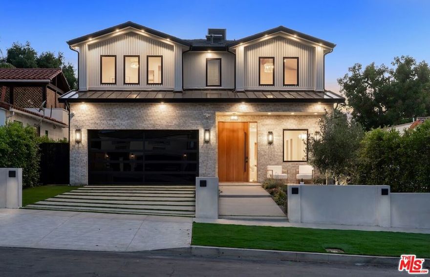Step into refined modern luxury at this brand-new, custom-built estate located South of the Boulevard in the heart of Sherman Oaks. Featuring 6 bedrooms and 6.5 bathrooms, includes an attached ADU 1 bedroom and 1 bathroom. The main residence spans 3,885 square feet, with the ADU adding 725 square feet of additional living space. The home seamlessly blends organic textures with contemporary elegance, offering warm, inviting interiors and flawless design.The open-concept living area features custom built-ins, wide-plank oak flooring, a linear fireplace with a natural stone surround, and floor-to-ceiling sliding doors that flood the space with light and offer true indoor-outdoor flow. The gourmet kitchen is outfitted with sleek cabinetry, natural stone countertops, a statement waterfall island, and top-tier appliances  designed for both function and form.Retreat to the primary suite with vaulted ceilings, a spa-like bath, and generous walk-in closet space. Each secondary bedroom is en-suite, offering privacy. A beautifully landscaped backyard with a pool and lounge area is ideal for entertaining.Located on a quiet, tree-lined street moments from Ventura Blvd's best schools, shops, dining, and cafes.