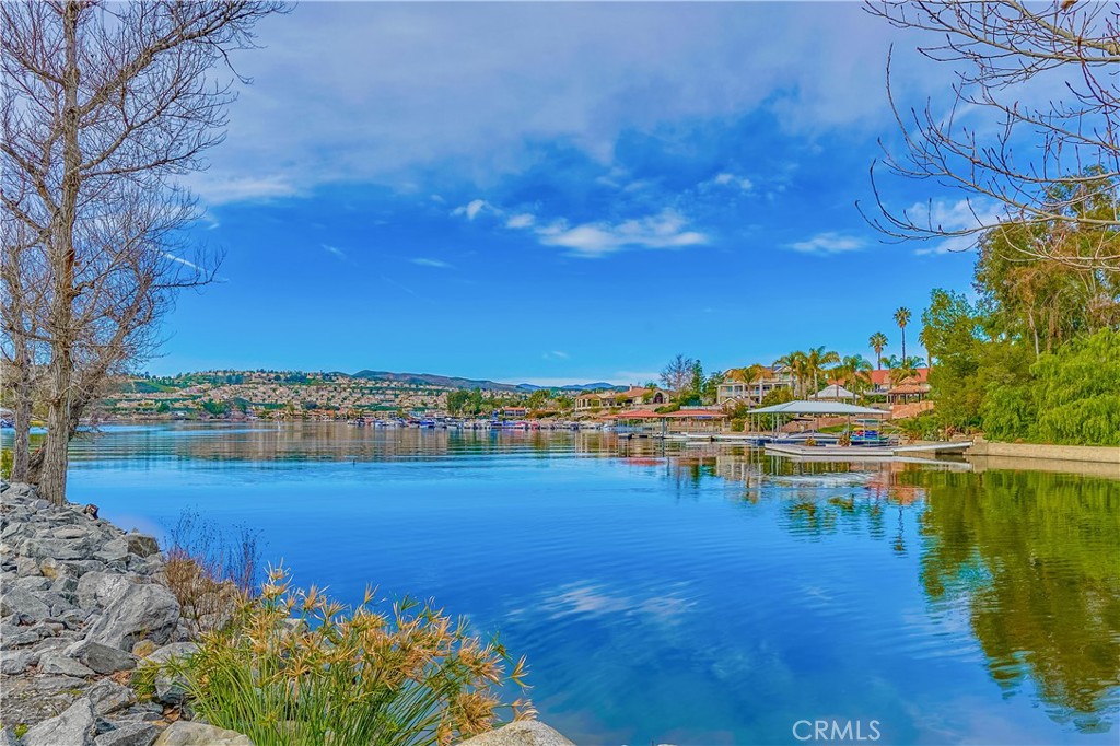 Welcome to one of Canyon Lake’s finest hidden gems a beautifully maintained Canyon Lake estate offering space, privacy, and stunning views from multiple rooms throughout the home. Nestled at the end of a quiet cul-de-sac, this spacious property sits behind a long private driveway, providing an elevated sense of seclusion and curb appeal.
With 3,370 sq ft of living space, this 3-bedroom, 3-bathroom home is designed for both comfort and entertaining. The main level features a formal living room with soaring ceilings and a massive fireplace, a formal dining room, a cozy family room with its own fireplace, and a bright breakfast nook that connects to the gourmet kitchen with granite countertops and double ovens. There’s also a downstairs bedroom, a full bathroom, and a laundry room for added convenience.
Highlights include:
Three fireplaces total: in the formal living room, family room, and primary bedroom,
Attached 3-car garage,
Breathtaking lake and hill views from multiple rooms,
Elegant primary suite with a spa-inspired bathroom and private balcony,
Spacious game room loft — ideal for movie nights, pool table, or a home gym and
Located on a quiet cul-de-sac with full access to Canyon Lake’s resort-style amenities.
Enjoy everything Canyon Lake offers: private lake with boating and water sports, a championship golf course, equestrian center, tennis courts, clubhouse, parks, and 24-hour security.
This rare view home is priced to impress — Come and take a look before it's gone!