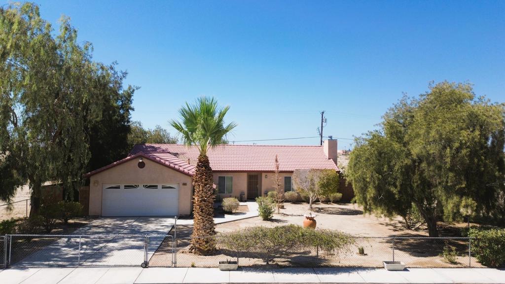 Spacious and well-maintained 3-bedroom, 2-bath home in Salton City, offering privacy, comfort, and a touch of desert charm. The property is fully gated, with a rear gate providing convenient access for off-road adventures. Both the front and back yards are beautifully landscaped with mature plants and trees, creating a peaceful outdoor retreat. Inside, you'll find generous living space throughout, with a layout that's both functional and inviting. The home is in great shape and ready to enjoy. A large storage unit in the back is perfect for tools, recreational gear, or hobbies. This is a fantastic opportunity to own a move-in-ready home with plenty of space and the perfect setup for desert living.