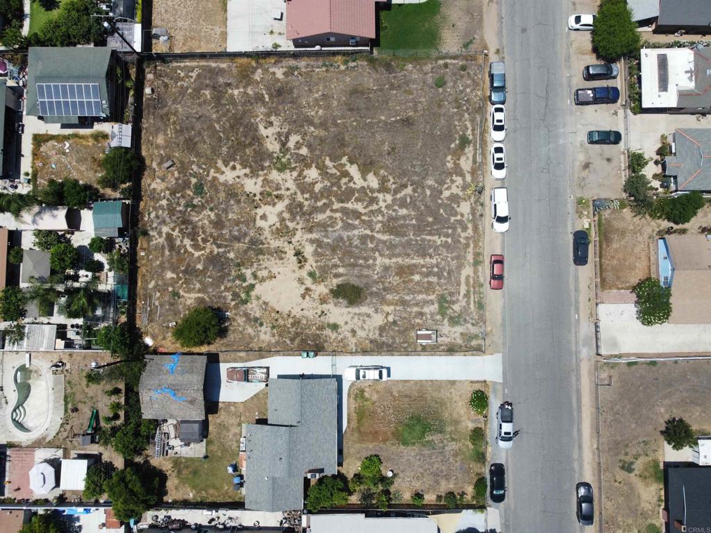 Incredible opportunity to build in a charming, established neighborhood in Corona. This spacious residential lot is zoned R-1 and allows for a custom home plus a guest house per city. Located on a quiet street lined with single-family homes, duplexes, and triplexes, the neighborhood offers a welcoming atmosphere just minutes from key conveniences. The property benefits from easy freeway access—both I-15 and the 91 freeway are nearby, making commuting and regional travel seamless. Families will appreciate proximity to Home Gardens Academy (K–8) just 0.4 miles away, and Santiago High School, approximately 3.2 miles from the site apartments.com Outdoor enthusiasts will enjoy nearby parks and recreation, including Hidden Valley Nature Center and Louis?Robidoux Nature Center within a short drive. Two additional lots zoned R-2 are also available from the same owner on the same street—one is directly adjacent and currently fenced together with this parcel. Buyers can choose to purchase this lot alone, pair it with either R-2 lot, or acquire all three parcels to build multiple homes, expand yard space, establish a family compound, or invest for the future. Utilities are nearby and can be easily connected as this is in a residential neighborhood. . This represents a rare opportunity to build and invest in established Corona neighborhood, offering flexibility, access, and long-term potential.