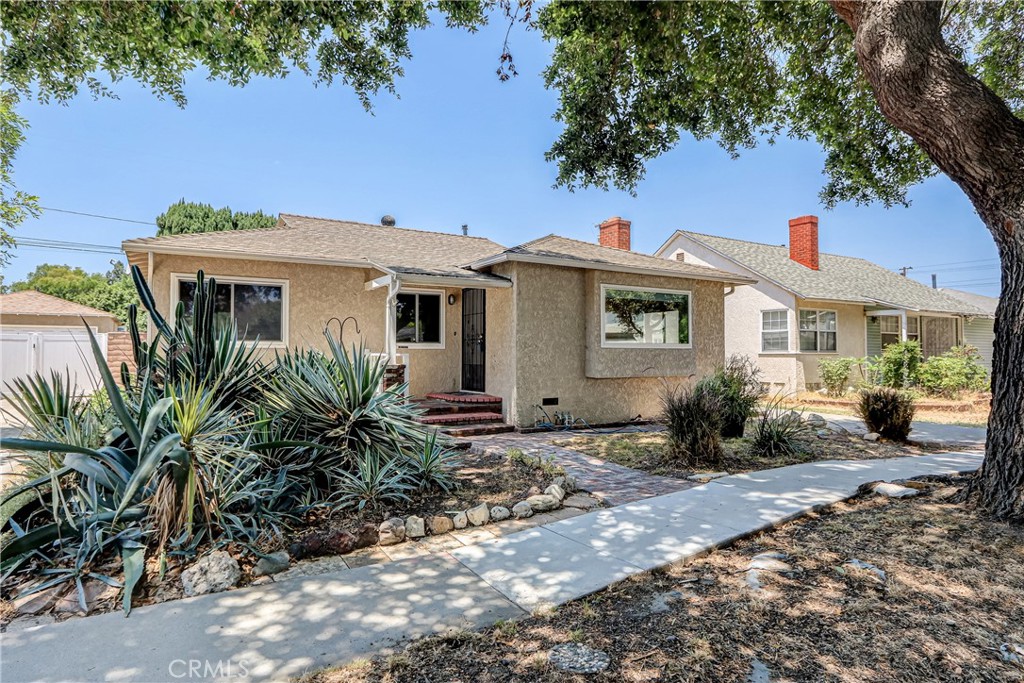 Light, bright and cheerful on a beautiful tree lined street. Spacious open kitchen with maple cabinets, granite counter tops, stainless steele stove and dishwasher and 2 "Lazy Susan's" Living room/ dining room with gleaming hardwood floors, bay window and gorgeous fireplace. Nice breakfast room off the kitchen ( which would be perfect for a home office). Fresh paint throughout. Large primary bedroom with 2 closets and brand new carpet which opens to the private backyard. The 3 other bedrooms have hardwood floors. Full bath with a beautiful tile and linen closet. Primary bath with dual sinks and nice sized shower. Forced heat and AC. Long driveway leads to a detached 2 car garage.