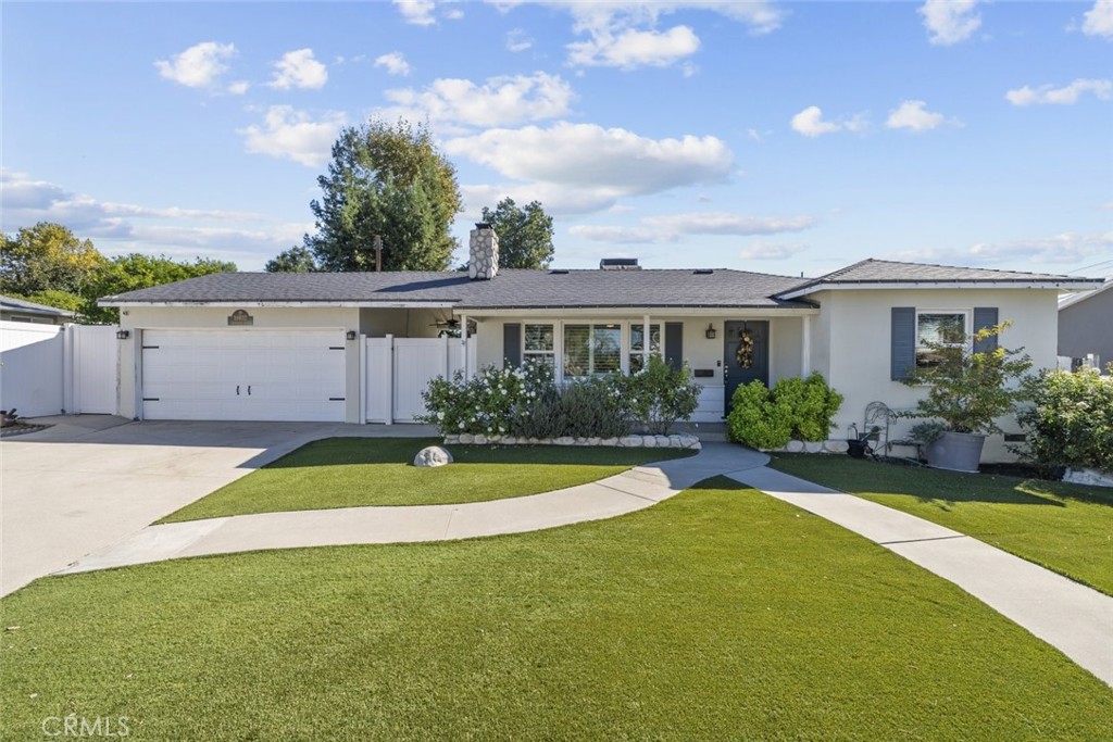 Granada Hills Pool Home!
Welcome to this beautifully maintained 2-bedroom, 1.5-bath home offering 1,038 sq. ft. of living space on a generous 5,870 sq. ft. lot. From the moment you arrive, the inviting curb appeal, white picket fence, paved driveway, and manicured front yard set the tone for what awaits inside.
Inside, you'll find an open floor plan filled with natural light, highlighted by recessed lighting, ceiling fans, and rich wood flooring throughout. The cozy living room features a stunning rock-accented fireplace, creating a warm and welcoming atmosphere. The kitchen boasts stainless steel appliances, a designated dining area, and double sliding doors that open to the backyard — perfect for seamless indoor-outdoor living.
The primary bedroom includes mirrored closet doors and a stylish en-suite bathroom with dual sinks and a shower/tub combo. A convenient laundry room with stackable washer and dryer adds everyday practicality.
Outside, enjoy your own private retreat. Take a dip in the sparkling pool, relax under the gazebo, or entertain friends and family in the spacious backyard. The 2-car garage has been thoughtfully converted into a man cave, offering a great bonus space for lounging, hobbies, or entertainment.
With tasteful white interior paint throughout, this home perfectly blends comfort, style, and functionality. Must see to appreciate.
Located within close distance to Granada Hills Charter High School, a large and highly regarded public charter school in the Granada Hills neighborhood.