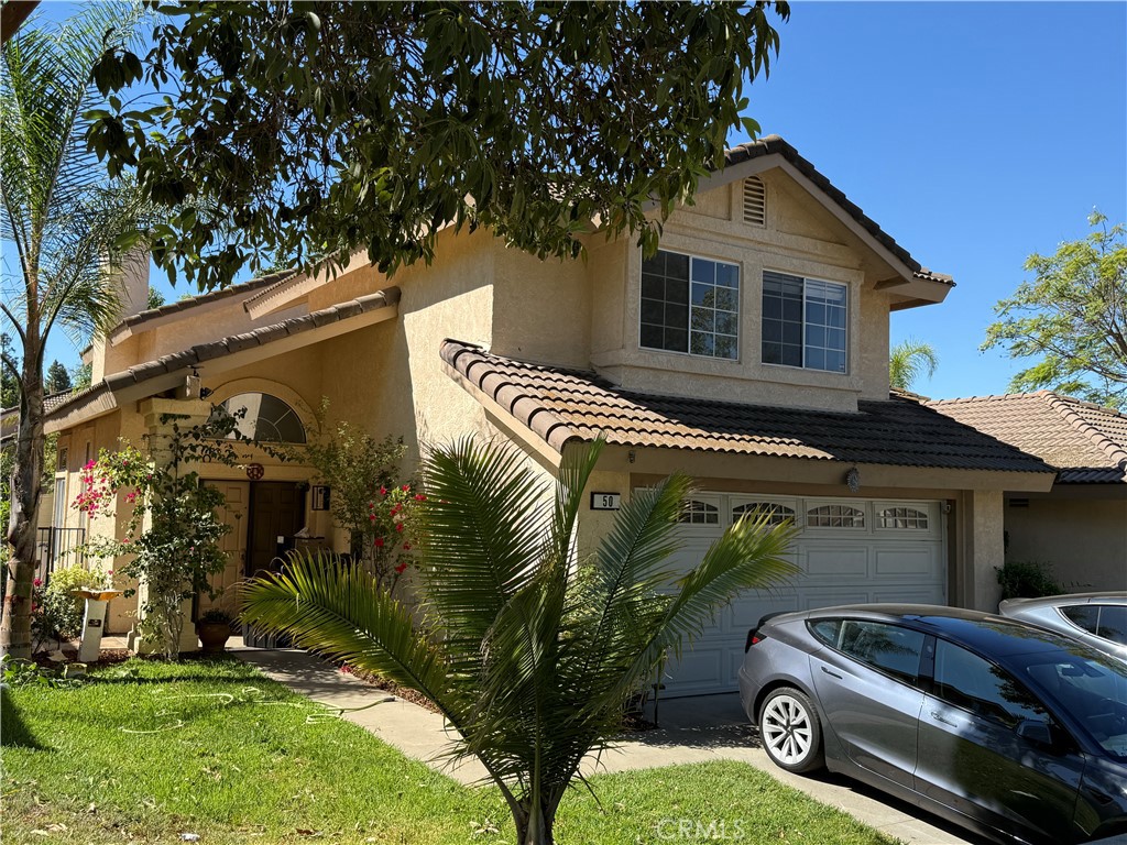 Welcome to The Greens at Wood Ranch, one of Simi Valley’s most sought-after communities known for its scenic beauty, family-friendly environment, and award-winning schools. This neighborhood offers a perfect balance of laid-back living with quick access to Los Angeles—just a 40-minute drive away. Residents enjoy exclusive amenities including a private lake, private park, golf courses, and some of the area’s best hiking trails. Whether you’re looking for a peaceful retirement setting or a vibrant family community, Wood Ranch is the ideal place to call home.
Step inside this renovated 3-bedroom, 2.5-bathroom home, offering 1,812 sq. ft. of living space on an 8,512 sq. ft. lot. The home features a spacious floor plan with soaring ceilings in both the living room and master suite, creating an open and airy atmosphere. The modern kitchen has been fully redone, complemented by brand-new stainless steel appliances, including a dishwasher and refrigerator. The first floor features durable tile flooring, while the upstairs showcases warm hardwood floors. The primary suite includes a walk-in closet, dual-sink vanity, and abundant natural light. One of the additional bedrooms also features its own walk-in closet, providing generous storage. Two bathrooms are located upstairs, with a convenient guest bath downstairs.
Enjoy gatherings in the expansive backyard and large front yard, perfect for outdoor entertaining. Additional highlights include mature fruit trees, a cozy fireplace, custom curtains from Dubai, smart sprinkler system, upgraded garage cabinetry, and the benefits of living in a close-knit gated community. With its combination of modern upgrades, community amenities, and prime Wood Ranch location, this home is an opportunity not to be missed.