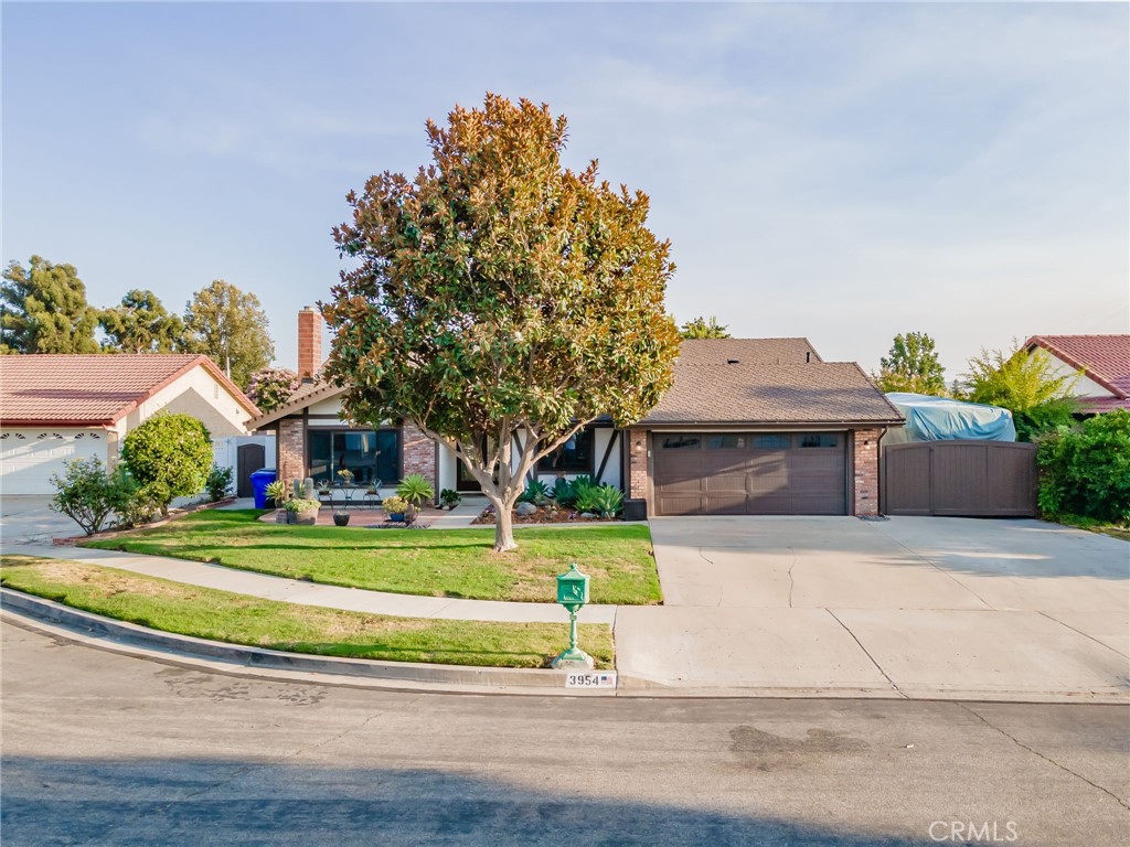 Charming Pool Home on a Quiet Cul-de-Sac Welcome to this beautifully maintained 3-bedroom, 2-bath home nestled on a peaceful cul-de-sac — offering the privacy and serenity you’ve been looking for. From the moment you arrive, you'll notice the great curb appeal, RV parking, and a spacious 4-car driveway leading to a 2-car garage with built-in storage. Step through the beautiful double-door entry into an open-concept living space, where natural light floods the large living room featuring a cozy brick fireplace. A separate den includes a charming coffee bar — perfect for entertaining or relaxing mornings. The remodeled kitchen, showcasing abundant storage, sleek quartz countertops, and stainless steel appliances. Laminate flooring flows seamlessly throughout the home, complemented by double-pane windows for energy efficiency and comfort. The spacious primary suite boasts vaulted ceilings, a ceiling fan, and three closets. Both bathrooms are tastefully updated to match the home’s modern touches. Step outside to your own private oasis — a recently remodeled pool and spa featuring three stunning sheer descent waterfalls, all easily controlled by iAqualink automation. All of the custom pool features are easily controlled by a phone app! Perfect for entertaining or unwinding under the stars. Additional highlights include owned solar panels installed in 2021, ensuring energy savings year-round. This home truly has it all — location, upgrades, privacy, and style. Don’t miss this rare opportunity!