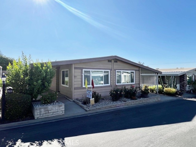 Move-in Ready!!! Welcome to Valencia Lea, Highland’s premier +55 community! This 2/2 1977 Silvercrest Buckingham 1344 sq ft home features a large front patio with citrus and mature roses! You’ll love sitting out on the patio enjoying morning coffee or an alfresco dinner conveniently located off your family room slider. This home includes 2 bedrooms, 2 baths with family room with upgraded dual pane windows. The open living and dining areas feature plenty of windows letting in tons of natural light. The dining room includes a large built-in for all your China. The kitchen has a breakfast bar, newer stainless-steel appliances and included fridge. The family room is just off the kitchen, perfect for informal living. The laundry room has plenty of storage and a door to the carport to easily get groceries in from your car, washer and dryer included. The guest bedroom and bath are perfect for visiting friends and family. The primary bedroom features a large walk-in closet. The attached bath has a large garden tub to relax in and a separate shower, with plenty of storage. The full-length carport includes a storage shed. Don’t delay in taking a tour!