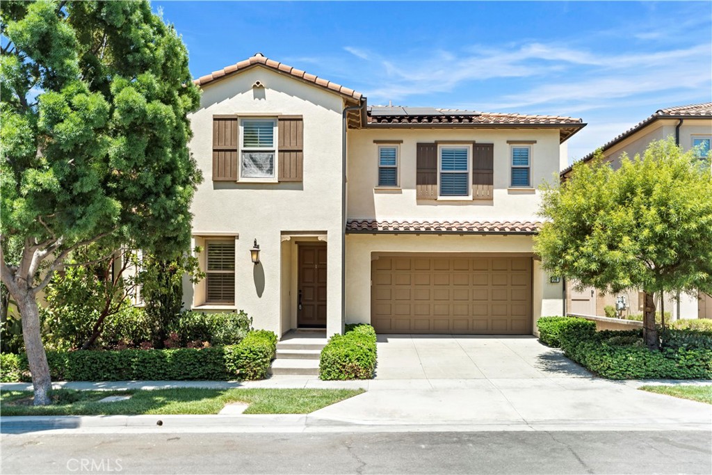 Beautifully upgraded home in a quiet interior location of the sought-after Stonegate community. Featuring 4 bedrooms, 4 full bathrooms, a spacious upstairs bonus room, and an attached 2-car garage, this home offers approximately 3,300 square feet of comfortable living space. One bedroom with full bath is conveniently located on the main level.
Interior highlights include rich hardwood flooring, crown molding, plantation shutters, custom drapery, recessed lighting, and a cozy fireplace. The open-concept great room connects seamlessly to the California room through large bi-folding doors, creating the ideal indoor-outdoor living experience. The gourmet kitchen is equipped with quartz countertops, subway tile backsplash, upgraded white cabinetry, built-in KitchenAid stainless steel appliances, an oversized center island, a walk-in pantry, and a built-in home management nook. A water filtration system is also installed, providing clean & drinkable water.
Upstairs, the spacious primary suite offers an oversized walk-in closet and a beautifully upgraded bath with soaking tub, walk-in shower, and dual vanities. All bedrooms feature their own full bathrooms. The upstairs laundry room includes ample cabinetry and a utility sink, and the large bonus room is perfect for a home office, media room, or playroom.
The backyard is designed for entertaining, with a covered California room, built-in BBQ, porcelain tile patio, and mature landscaping for added privacy. Energy-efficient features include 20 fully paid-off solar panels, a water softener system, and a Tesla wall charger—all included with the home. Prime location close to parks, pools, Jeffrey Trail, and award-winning schools. Move-in ready!