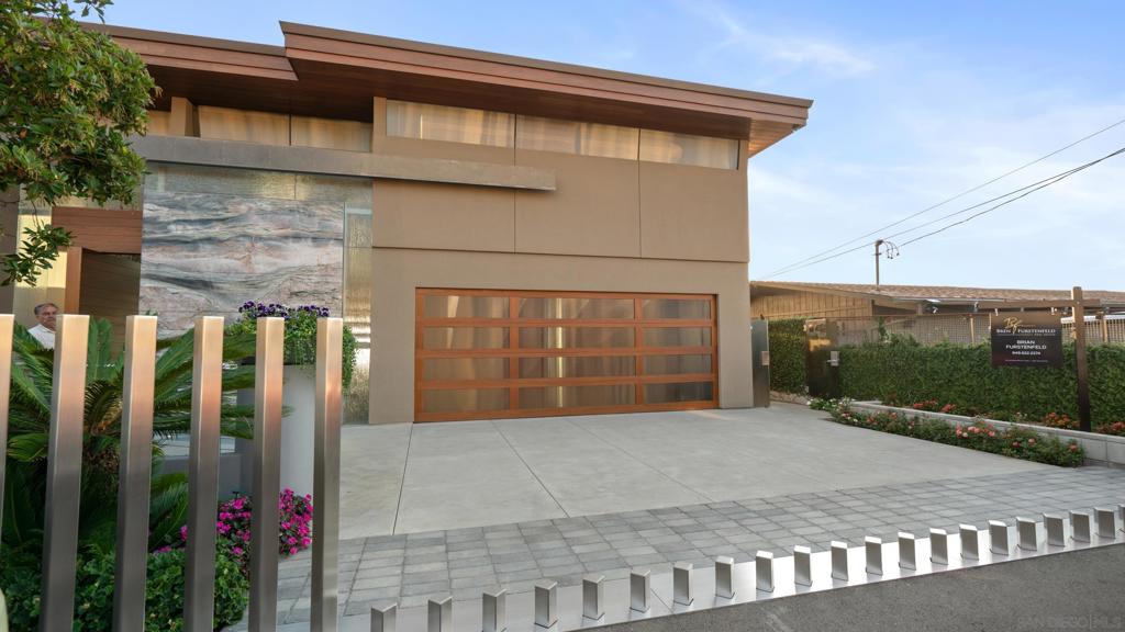 A rare opportunity to own Encinitas’ most significant new construction oceanfront estate. Located on the prized bluff at 1230 Neptune Avenue, this modern coastal masterpiece spans 7,089 sqft and offers private beach access, an amenity almost unheard of in today’s regulatory climate. Secured under a 2008 Coastal Dev Permit, it is the final oceanfront home of its kind permitted in California, making it truly irreplaceable. Every detail of this 4-bedroom, 7-bathroom residence has been designed for elevated coastal living, with glass walls that frame panoramic ocean views and a commercial-grade elevator connecting all levels. Amenities rivaling those found in Del Mar, La Jolla, or Malibu include a state-of-the-art theater, lounge bar, teak wine cellar, gym, spa, sauna, and bluffside Jacuzzi. The retractable beach staircase leads to one of the most coveted stretches of sand in North County. Unsurpassed in quality and privacy, this architectural tour de force would command nearly double or more in other premier coastal markets. Encinitas is a vibrant coastal town and destination for those seeking a healthy, outdoor lifestyle offering elite beaches, surfing, and hiking alongside a thriving arts and culture scene immersed in a kaleidoscopic habitat, renowned as the "Flower Capital of the World". Just minutes from Carlsbad Airport, this San Diego oceanfront gem delivers an unmatched combination of privacy, innovation, and refined coastal elegance. From its legal entitlements to its breathtaking execution, 1230 Neptune Ave is not just a home, it’s a legacy built to last.