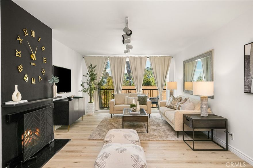 Welcome to Crescent Heights, where modern elegance meets vibrant city living. Perched in a prime location, this 2-bedroom, 2-bathroom condo boasts sweeping views of the scenic West Hollywood Hills—offering a daily backdrop of natural beauty and urban sophistication. Step inside to an open, light-filled layout appointed with luxury vinyl plank flooring and chic, contemporary design choices. The remodeled kitchen impresses with quartz countertops, custom cabinetry, and designer fixtures—perfectly suited for both everyday living and effortless entertaining. The spacious living and dining areas flow seamlessly onto a private balcony, an ideal spot to sip morning coffee or toast the sunset against a hillside silhouette. Throughout the home, thoughtfully selected finishes and stylish décor create a cohesive sense of calm and modern refinement. Each bedroom serves as a peaceful retreat, complete with generous closet space and en-suite or adjacent bathrooms. The bathrooms mirror the home’s contemporary design with clean lines and updated fixtures, blending form and function with ease. Enjoy 2 assigned (non-tandem) parking spaces for maximum convenience. Additional highlights include access to premium community amenities: a sparkling pool, fitness center, and 24/7 security cameras. With Sunset Boulevard and Melrose Avenue just steps away, you'll enjoy unmatched walkability to world-class shopping, dining, and nightlife. Whether entertaining in style or enjoying a quiet evening at home, this is luxury L.A. living at its finest.