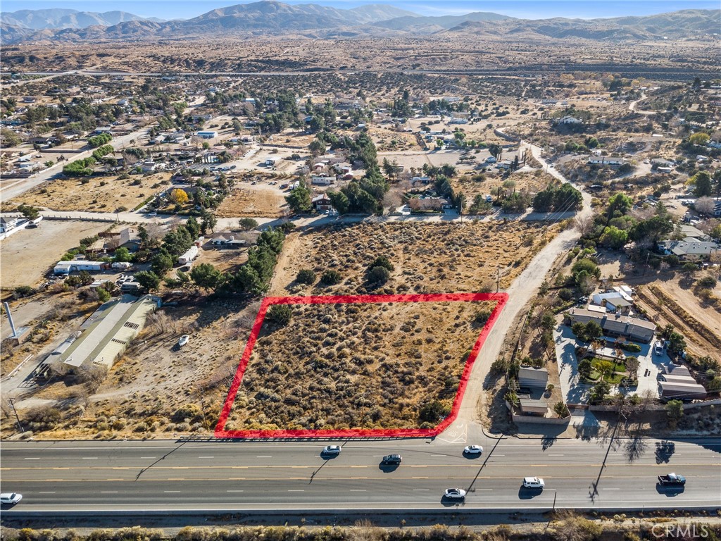 Nestled among custom-built homes, this lot provides the perfect blend of rural tranquility and proximity to work, shopping, and schools. Imagine waking up to breathtaking panoramic views, with ample space for your family, horses, and even a thriving garden filled with fresh produce. This spacious lot offers a unique opportunity to build your dream home in the serene Palmdale Hills community. Conveniently located on paved road frontage with water and electricity nearby, this property combines accessibility with the charm of quiet, country living. There are two contiguous parcels being sold separately, 3052-019-010&011. They are located back to back on the corner of Pearblossom Hwy and Valley Spring Rd. Buyer to verify the availability of utilities, water, and development potential with LA County Zoning and Planning. Don't miss this chance to own over an acre of elevated land with unbeatable views along Pearblossom Hwy!