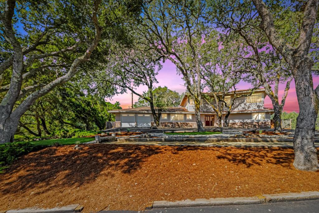 Silicon Valley Oasis with a scenic, uncongested commute north. Also a quick drive into Morgan Hill and all of the amenities, restaurants, events! You will also be near many wineries with fabulous events year round! Enter through your ornate leaded front doors, French style windows, beautiful tile work, molded door frames, and stained glass lights all lend character and a settled feeling to the home. Sunlit oak hardwood floors stretch out across the downstairs interior. Stainless steel appliances & big windows await you in the kitchen. The sliding glass door leads out to a deeply shaded back porch facing a pristine lawn ready to host epic parties. A full downstairs en-suite with a private backyard & entryway await the arrival of your guests, in laws or junior ADU! Enjoy nearly 180 views from your sprawling upstairs loft flanked by two primary suites with soaking tubs facing the backyard and extensive built-in storage. Plenty of open space with potential for a pool, outdoor kitchen and room for animals and gardening. Near great hiking trails and fishing at Uvas Lake. Newly paved driveway, detached 4 car garage/shop, finished garage/workshop space, storage sheds, 10k gallon water storage, a canvas shelter, only minutes to Morgan Hill, Gilroy and short commute to San Jose!