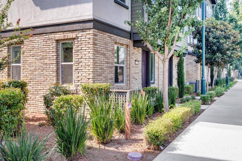Stunning large townhome in the highly desirable Iron Gate community! This premium corner unit features an open floor plan with an abundance of Natural Light! Model-like home boasts a gourmet chef's kitchen with modern white cabinets, gas stove top, beautiful backsplash, pantry & stainless steel appliances. There is a large bedroom with a full bath on the first floor. The 2nd floor features an expansive living room with hardwood flooring, plus a nice patio for relaxing. Three spacious bedrooms on the top floor, including the luxurious master suite with a walk-in closet. Two car garage. Tankless water heater. Top schools. Great neighborhood with lots of parks and a fantastic place to call it your home!